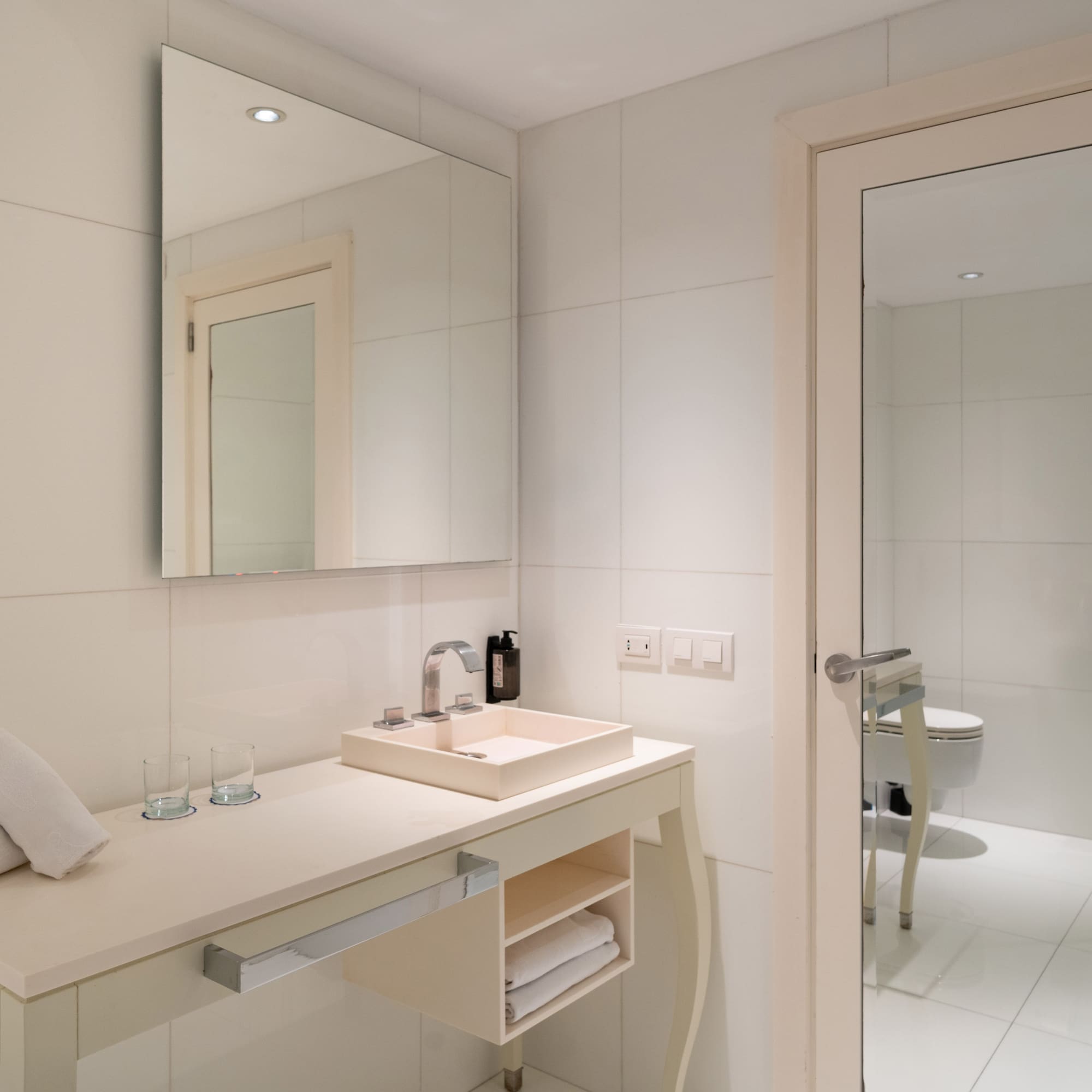 a bathroom with a mirror and sink