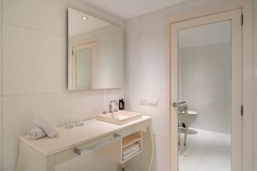 a bathroom with a mirror and sink