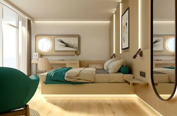 a bedroom with a bed and a chair