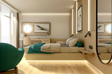 a bedroom with a bed and a chair