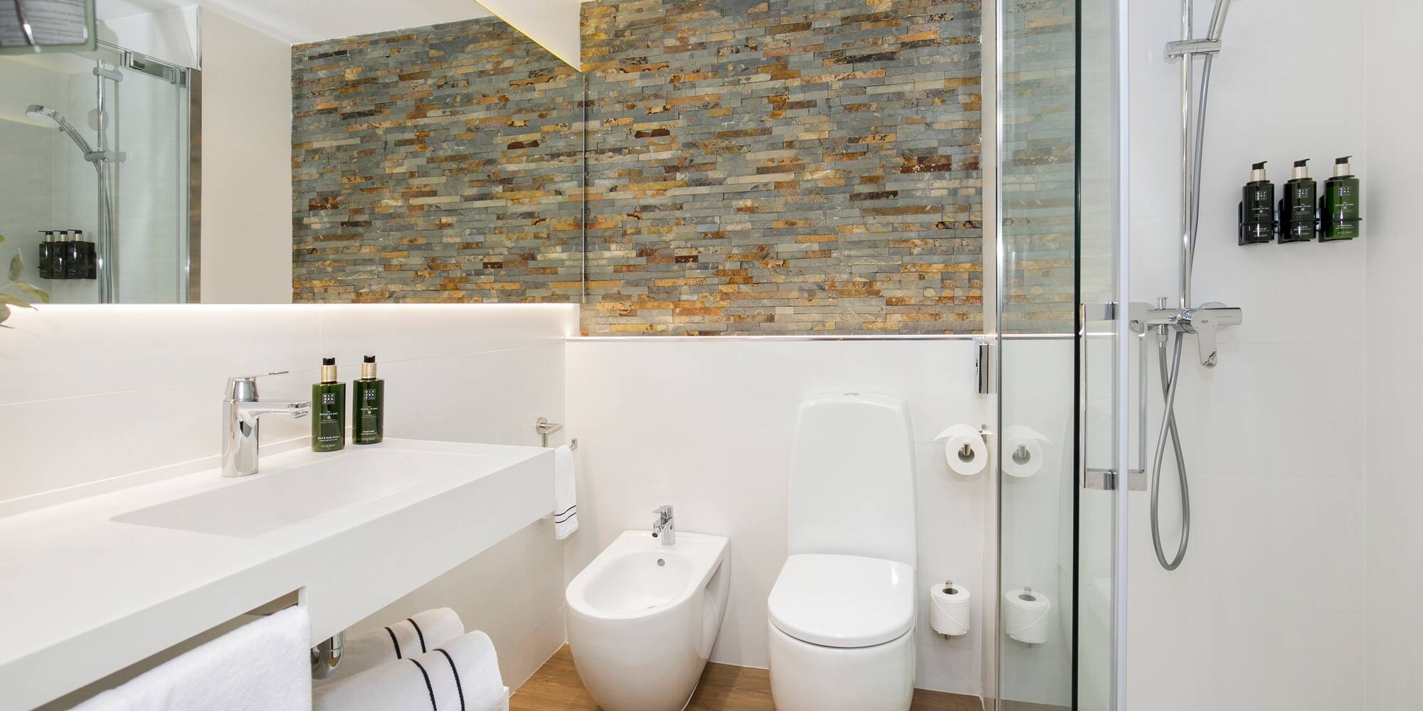 a bathroom with a shower and toilet