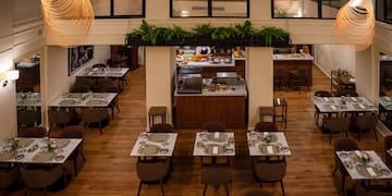 a restaurant with tables and chairs