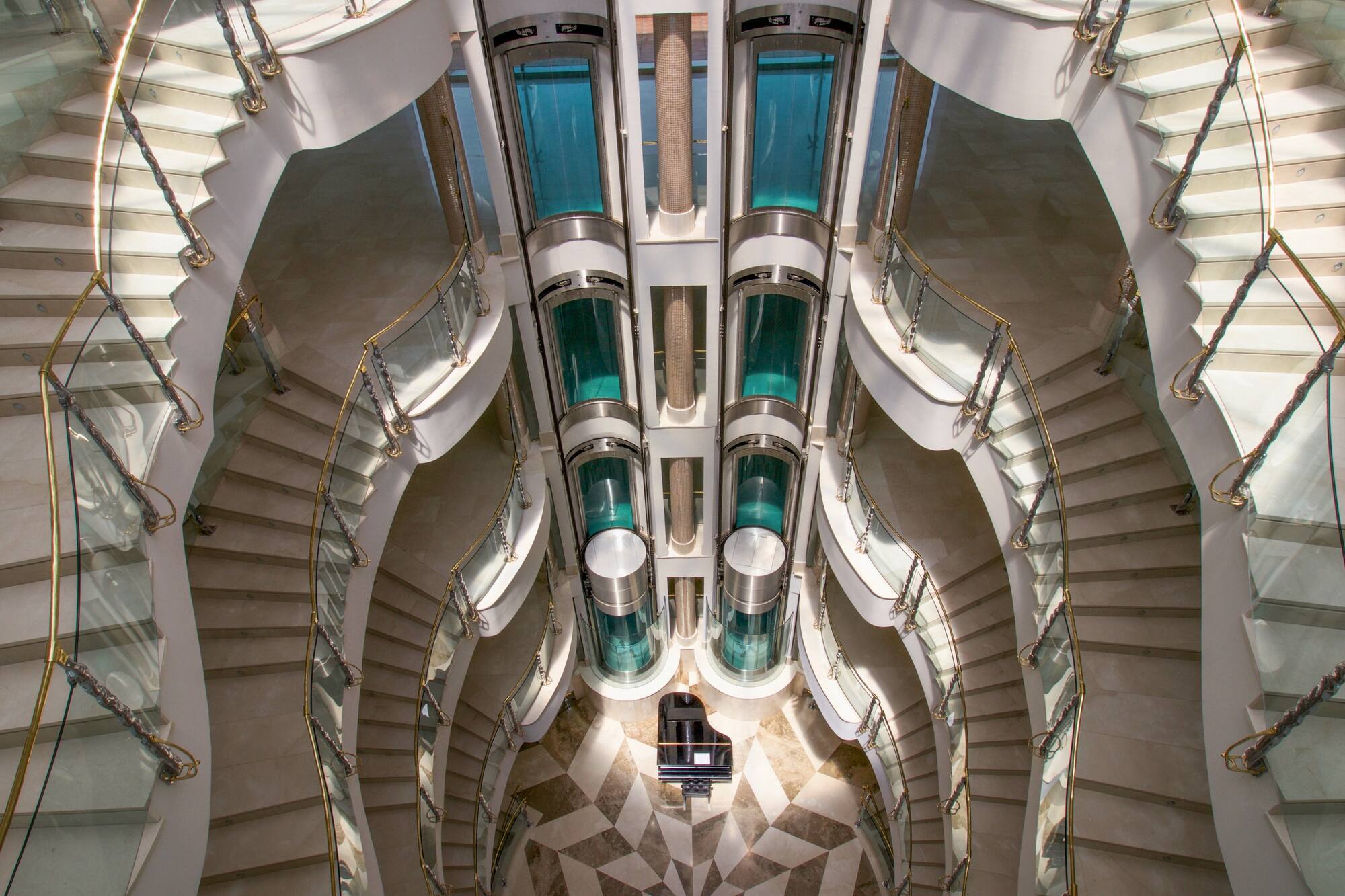 a spiral staircase with multiple elevators