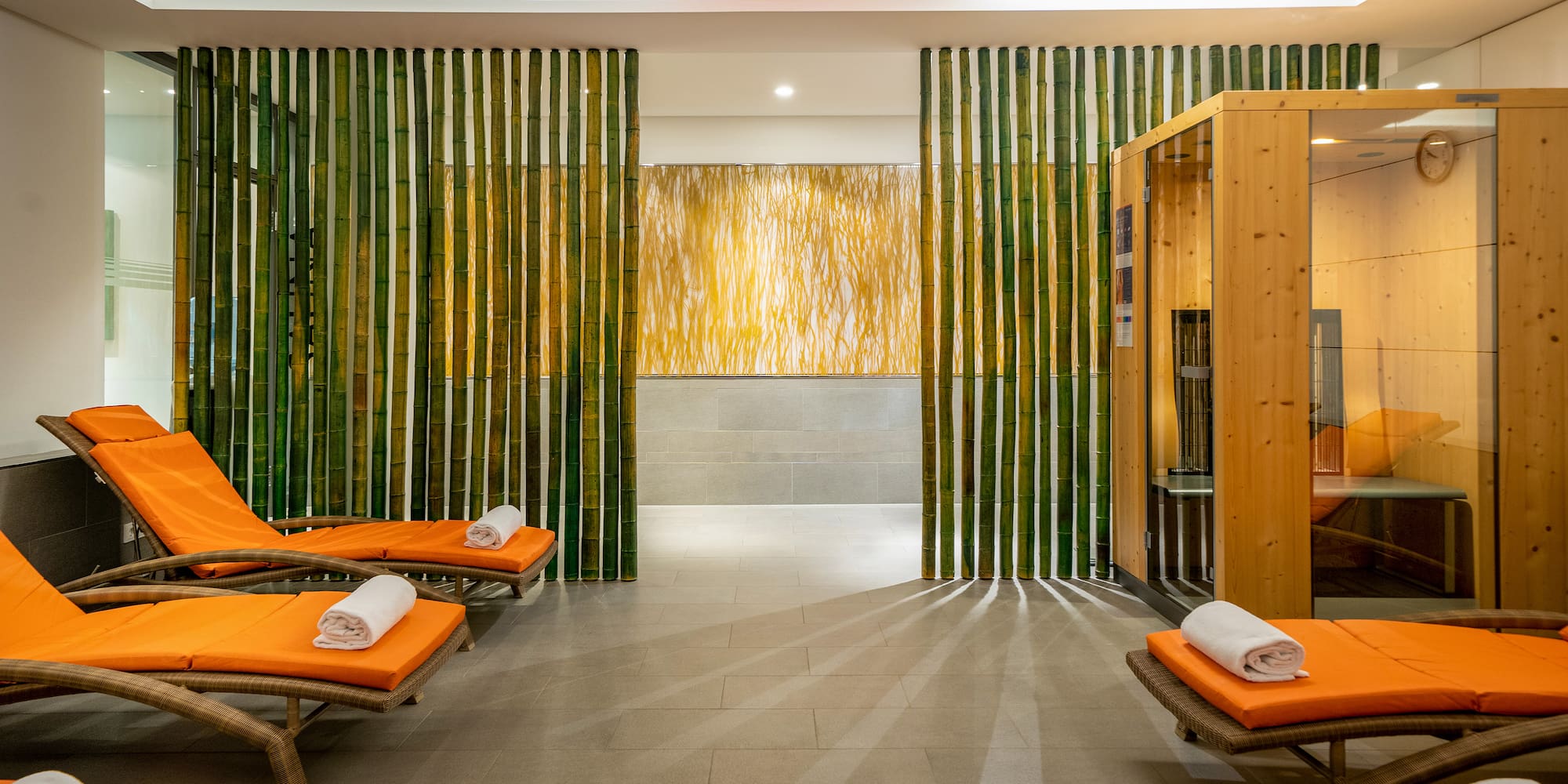 a room with chairs and a sauna