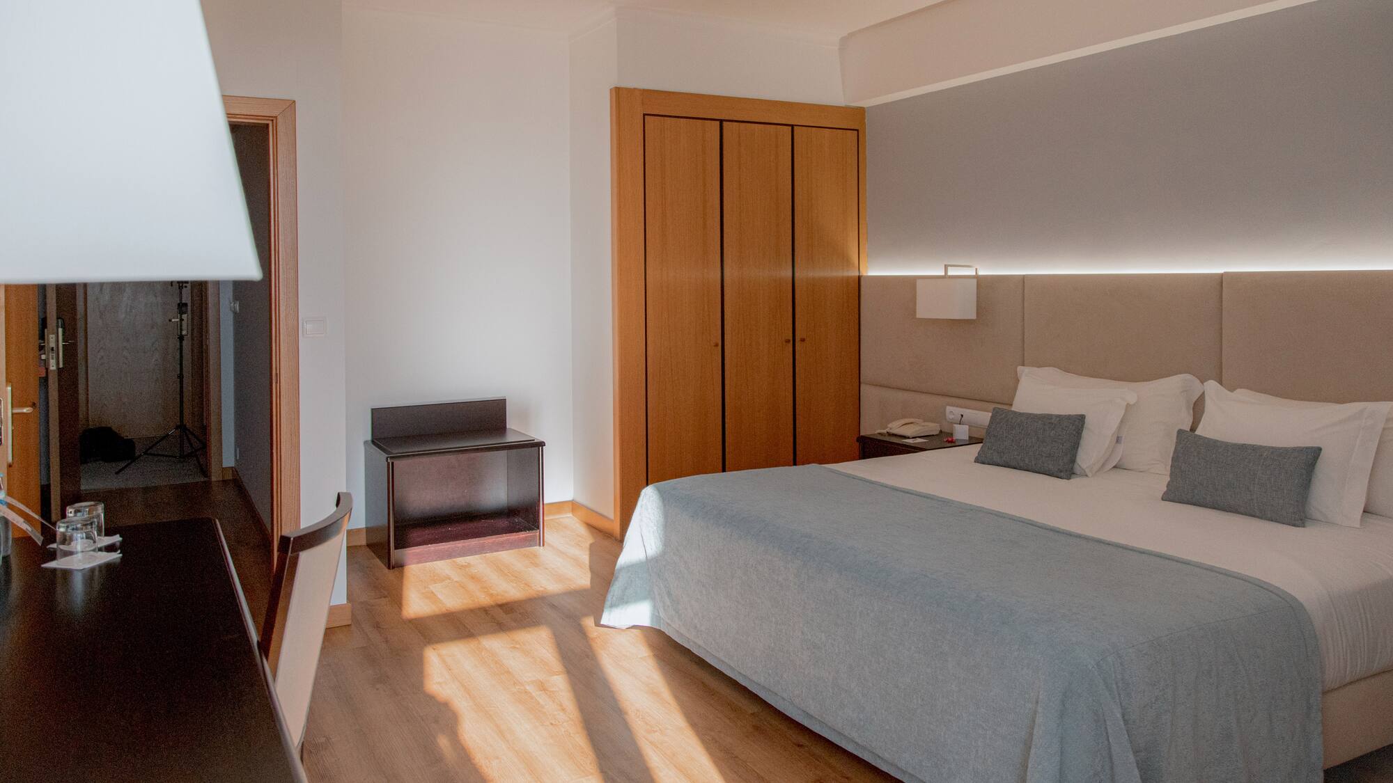 a bedroom with a bed and closets