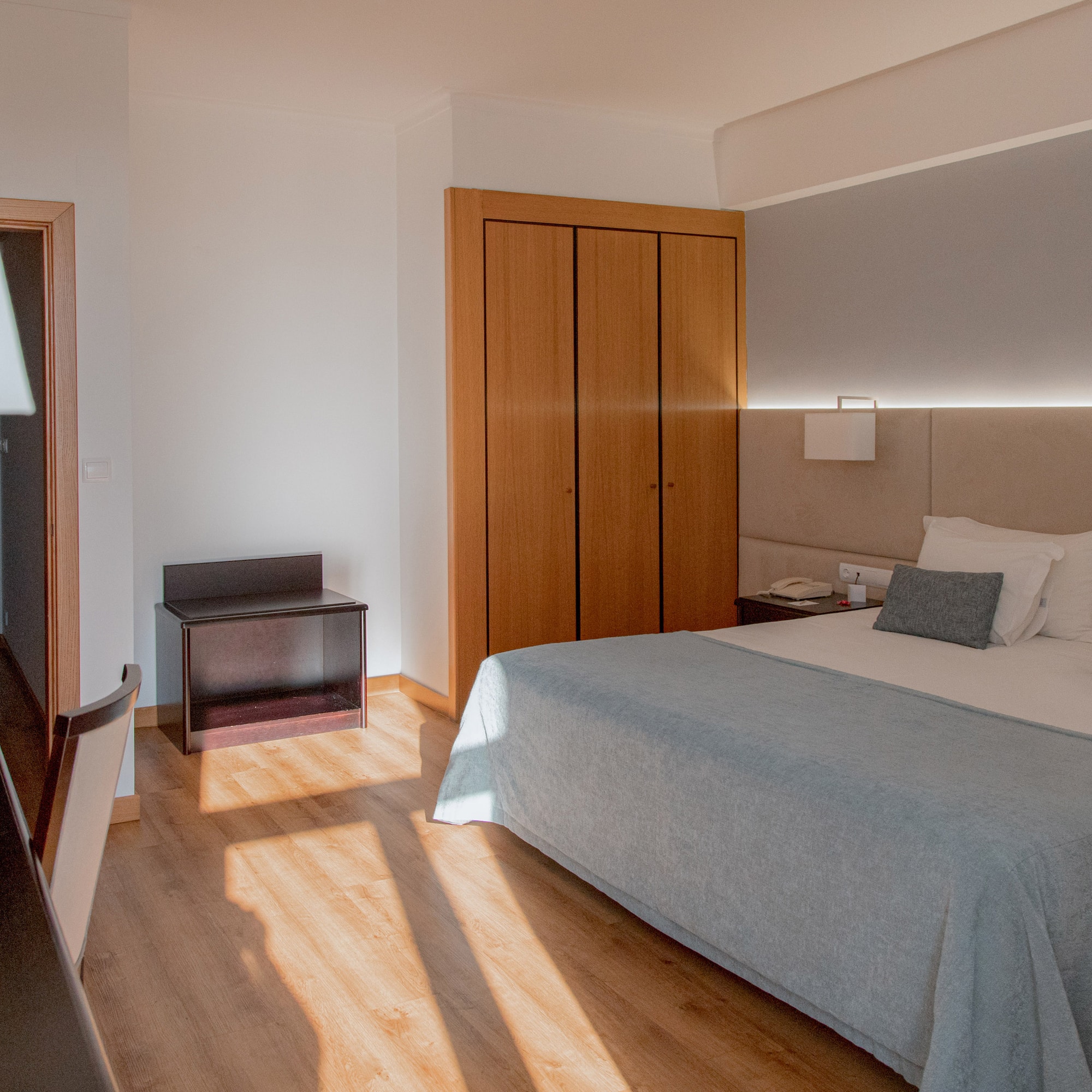 a bedroom with a bed and closets