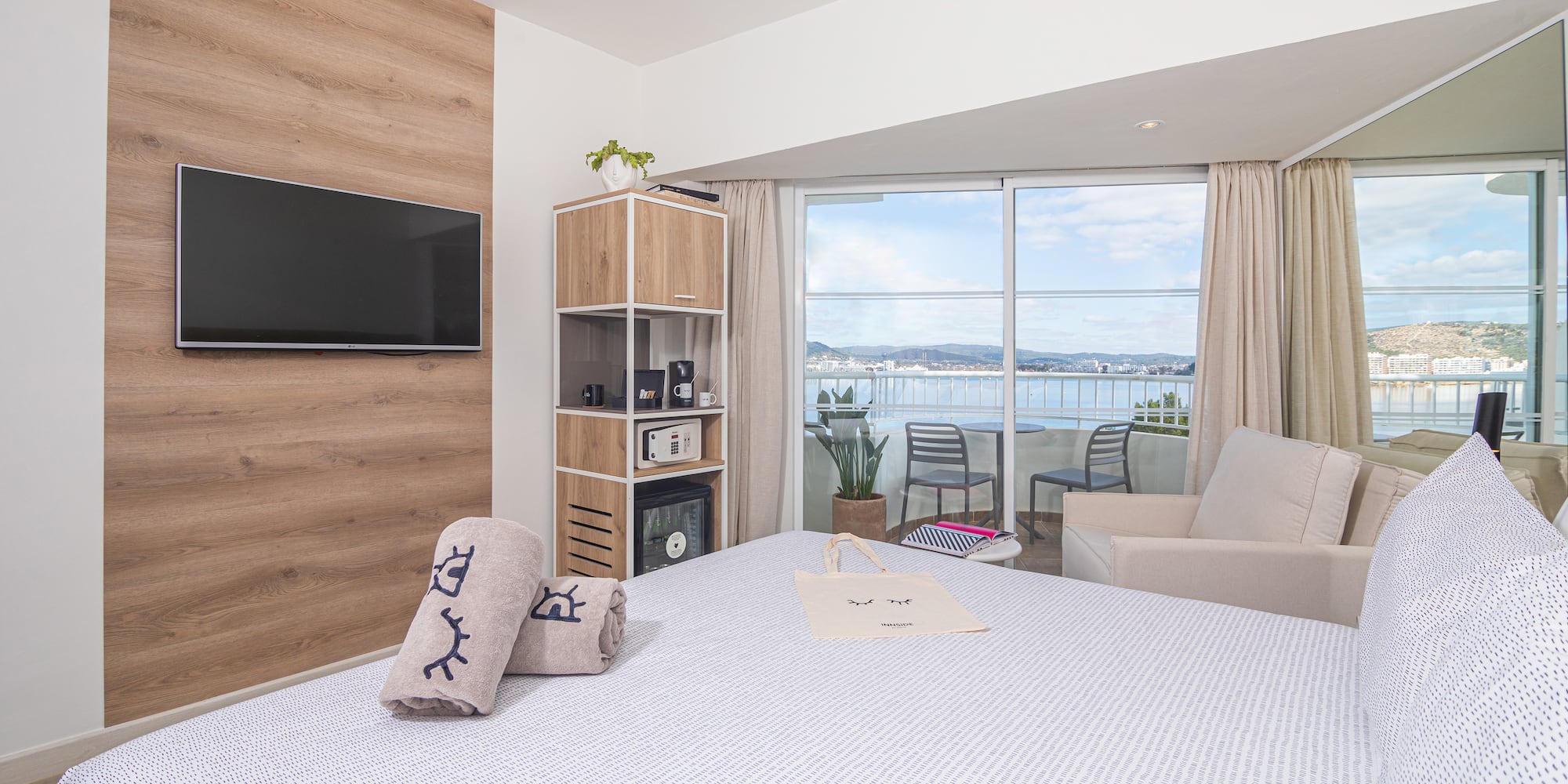 a room with a bed and a television