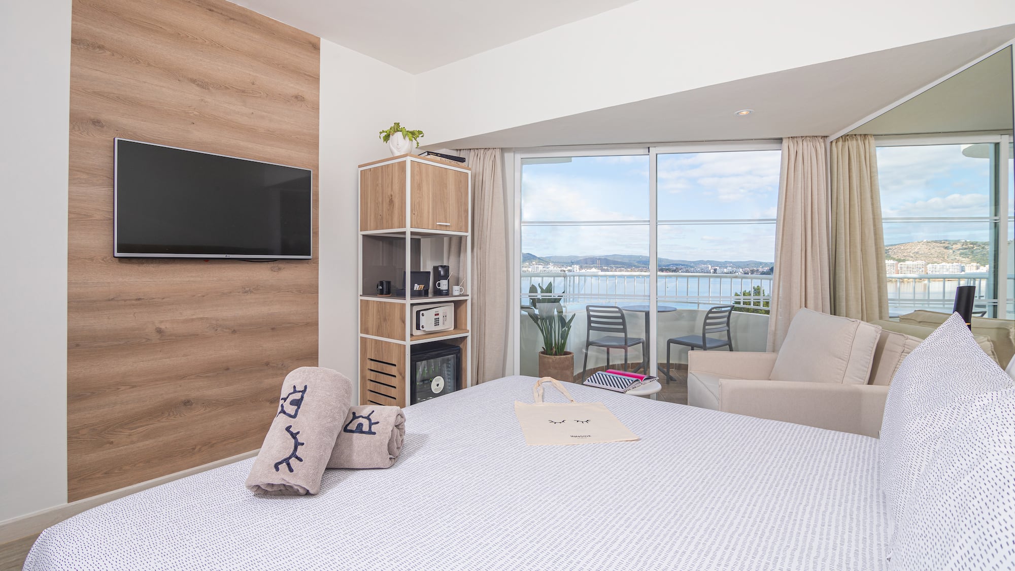 a room with a bed and a television