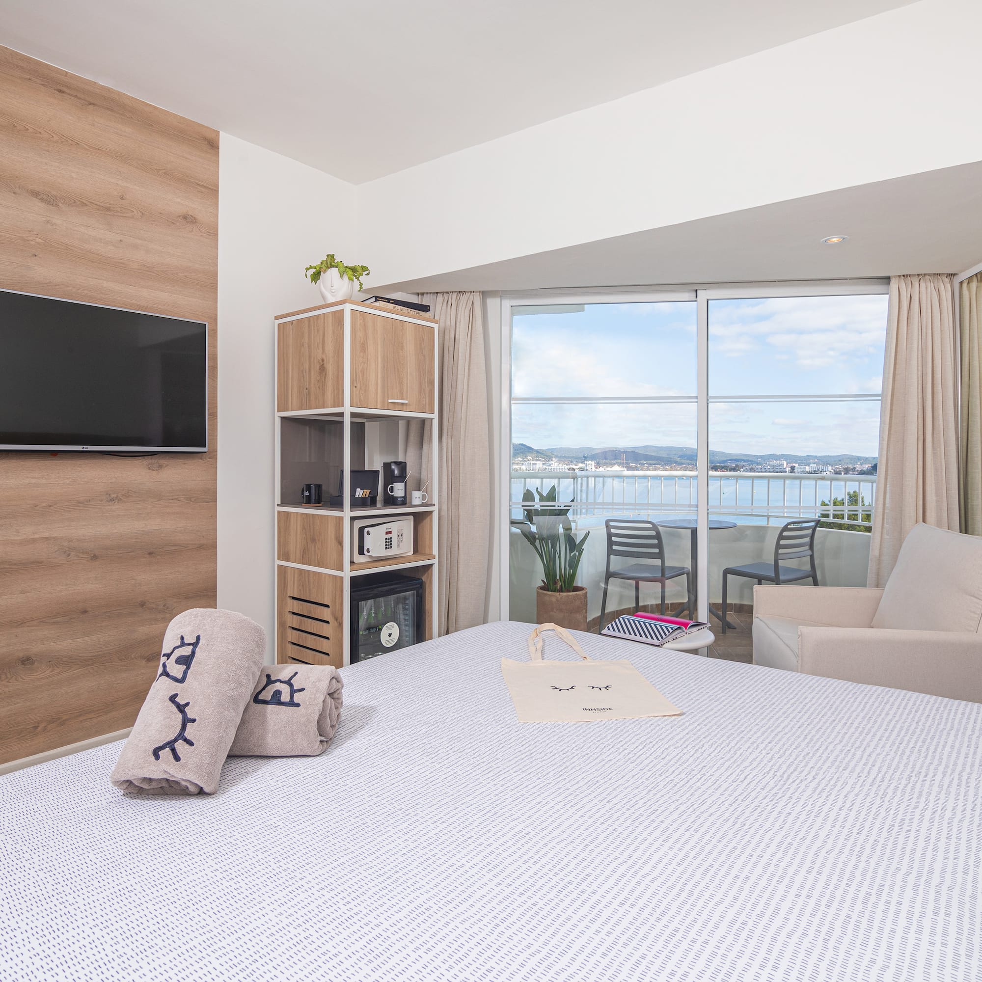 a room with a bed and a television