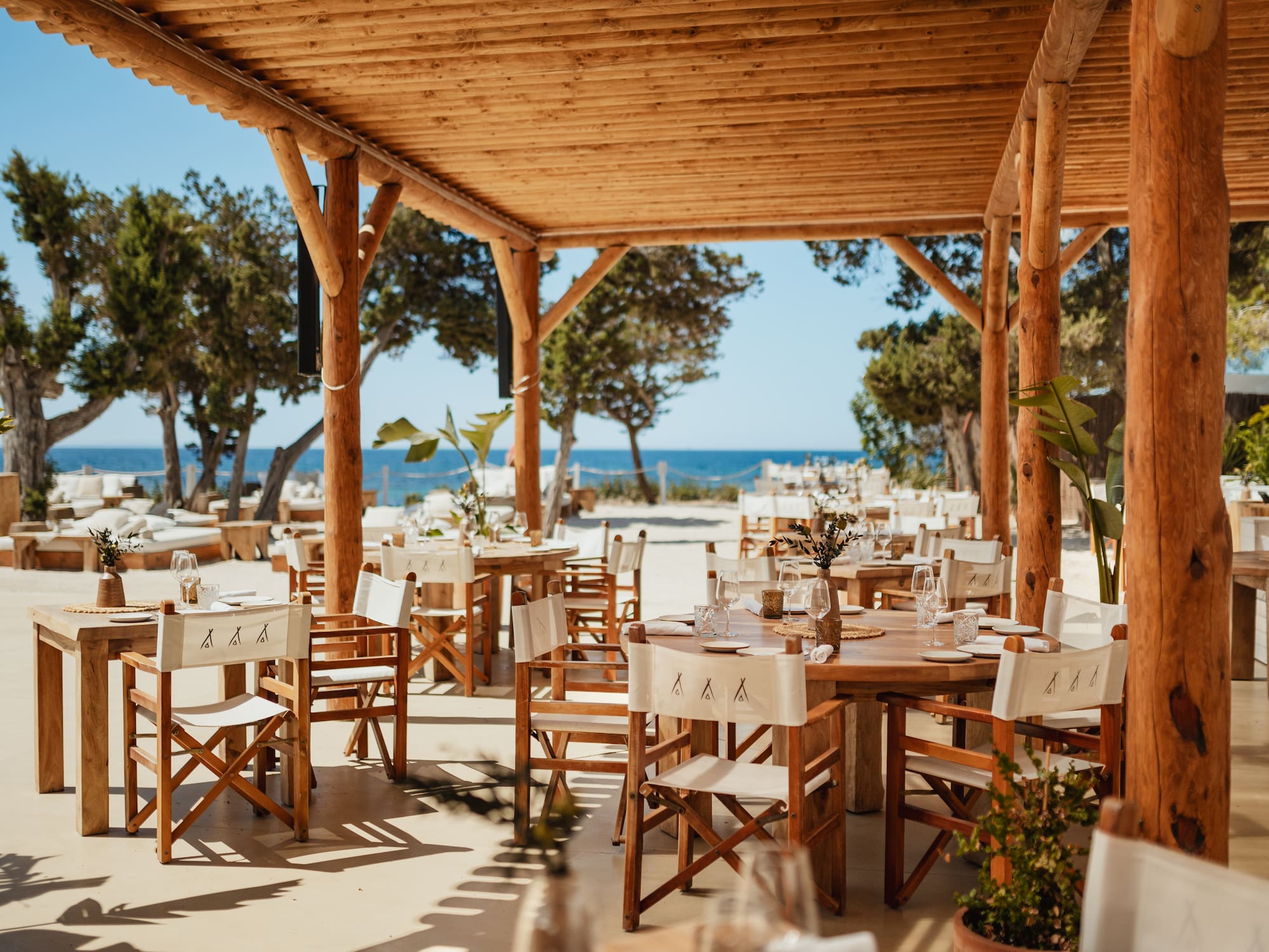 a table and chairs under a covered patio