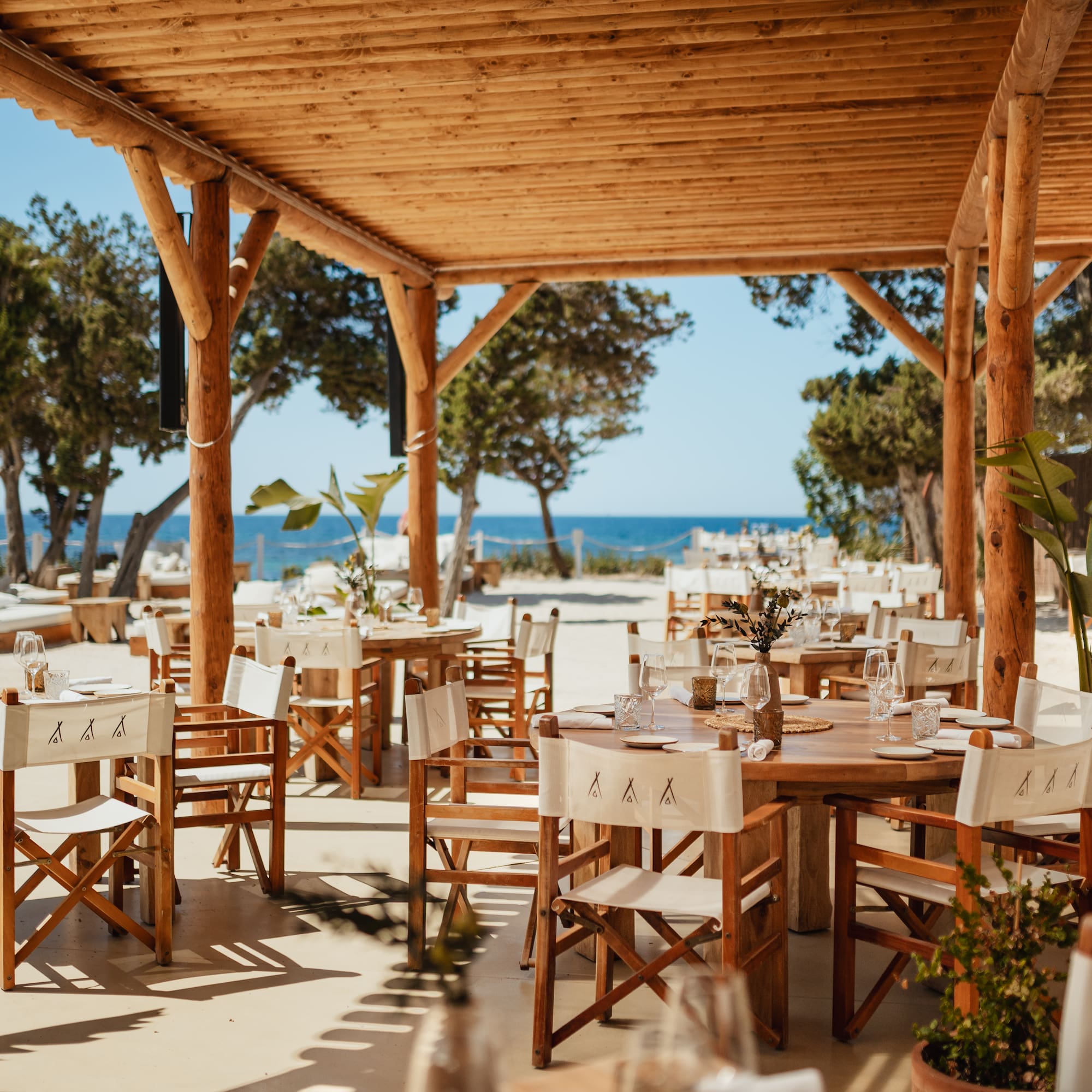 a table and chairs under a covered patio