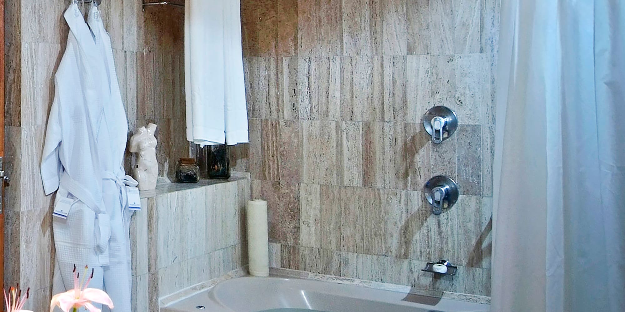 a bathroom with a bathtub and a sink