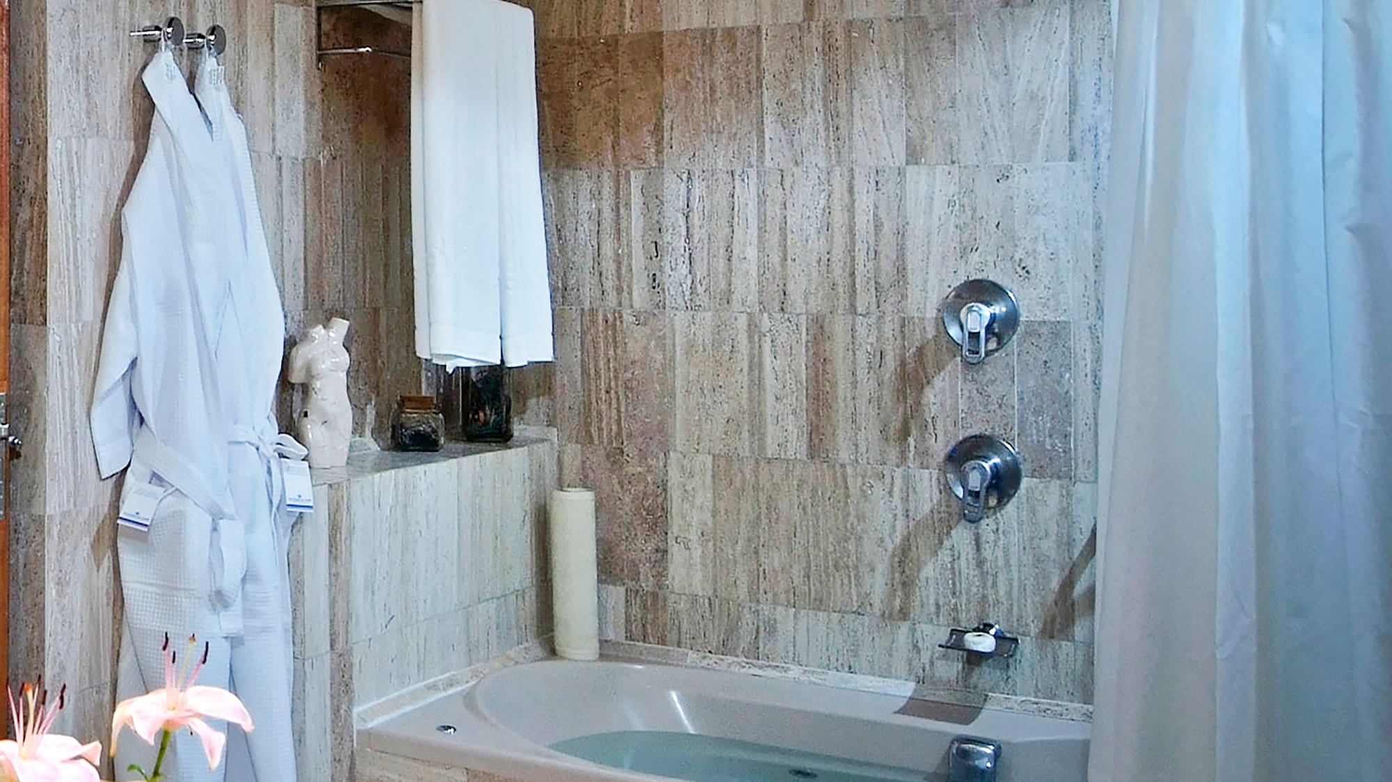 a bathroom with a bathtub and a sink