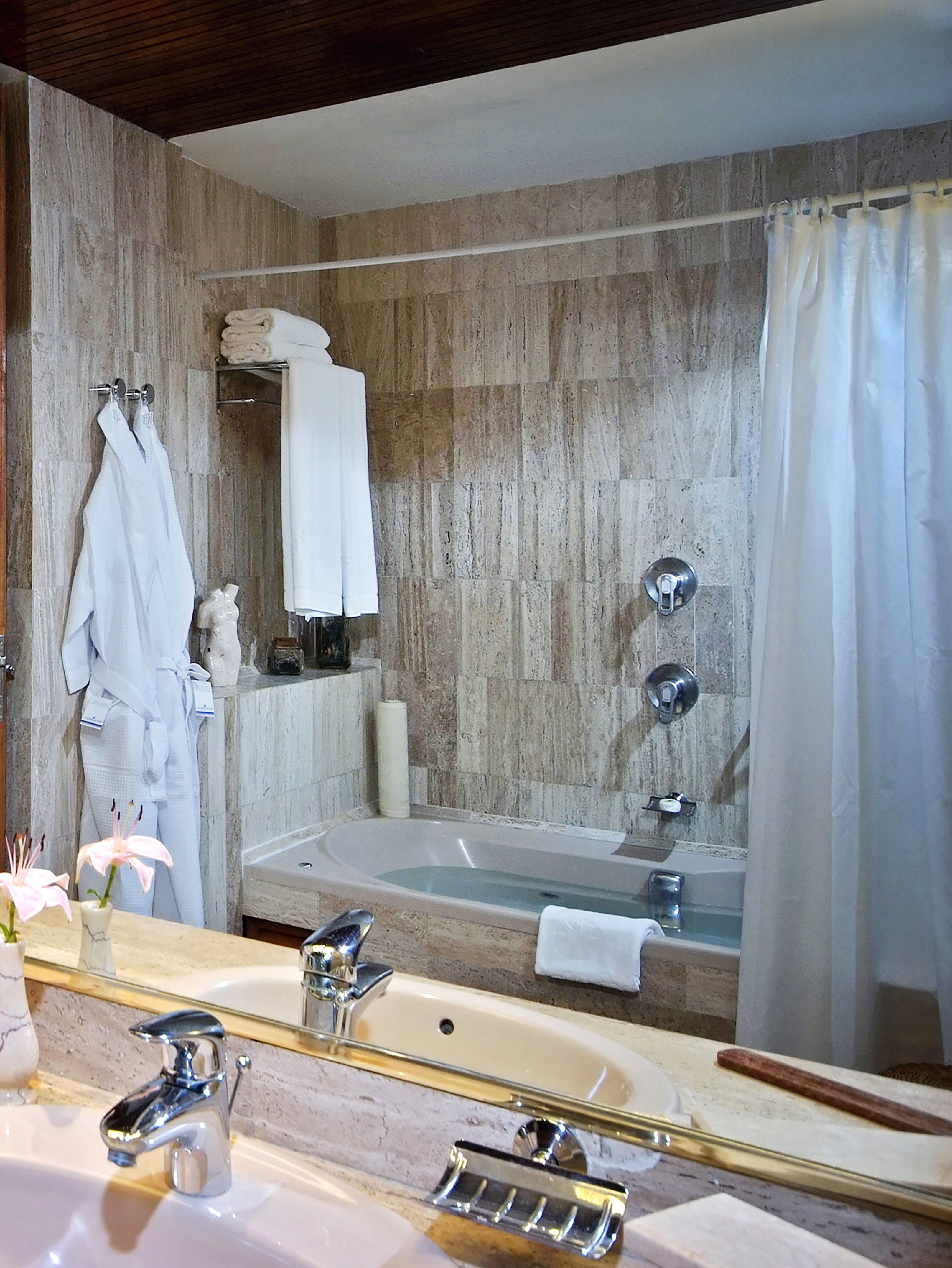 a bathroom with a bathtub and a sink