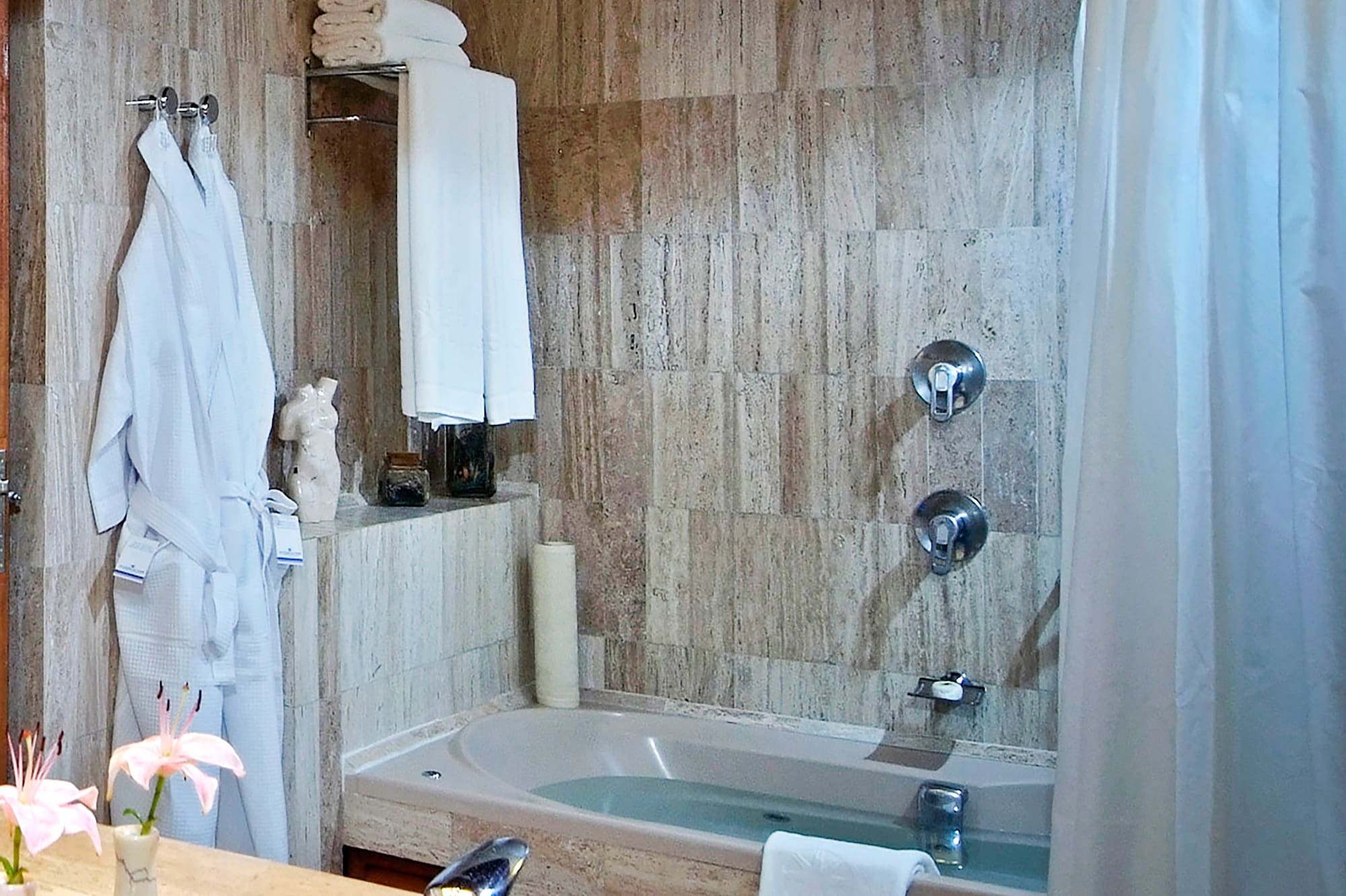 a bathroom with a bathtub and a sink