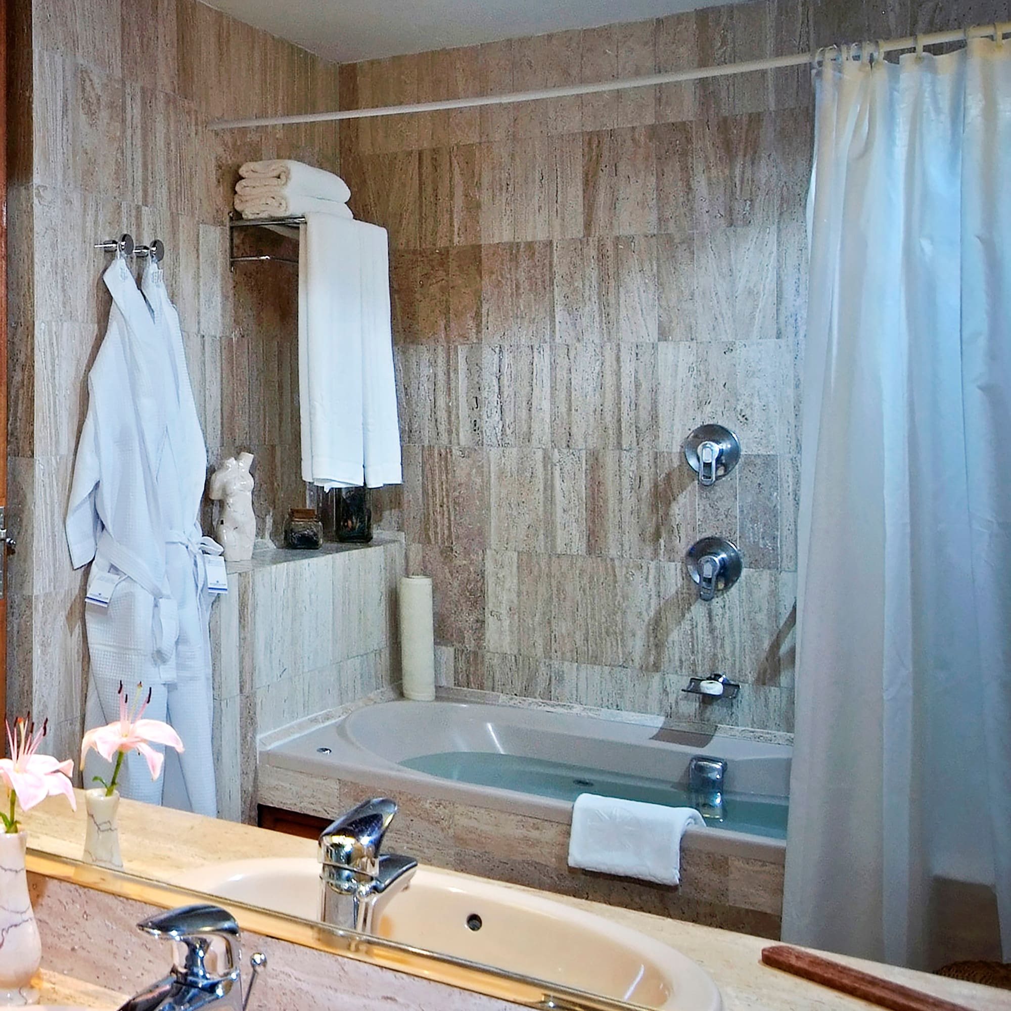 a bathroom with a bathtub and a sink