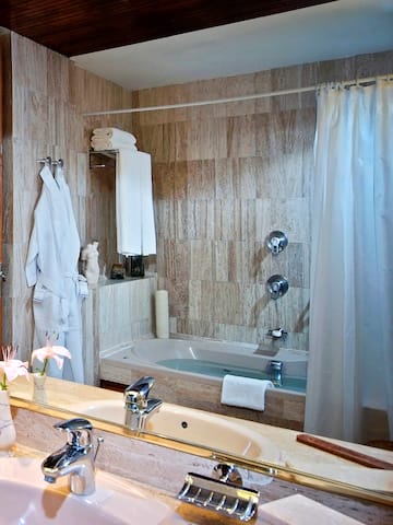 a bathroom with a bathtub and a sink