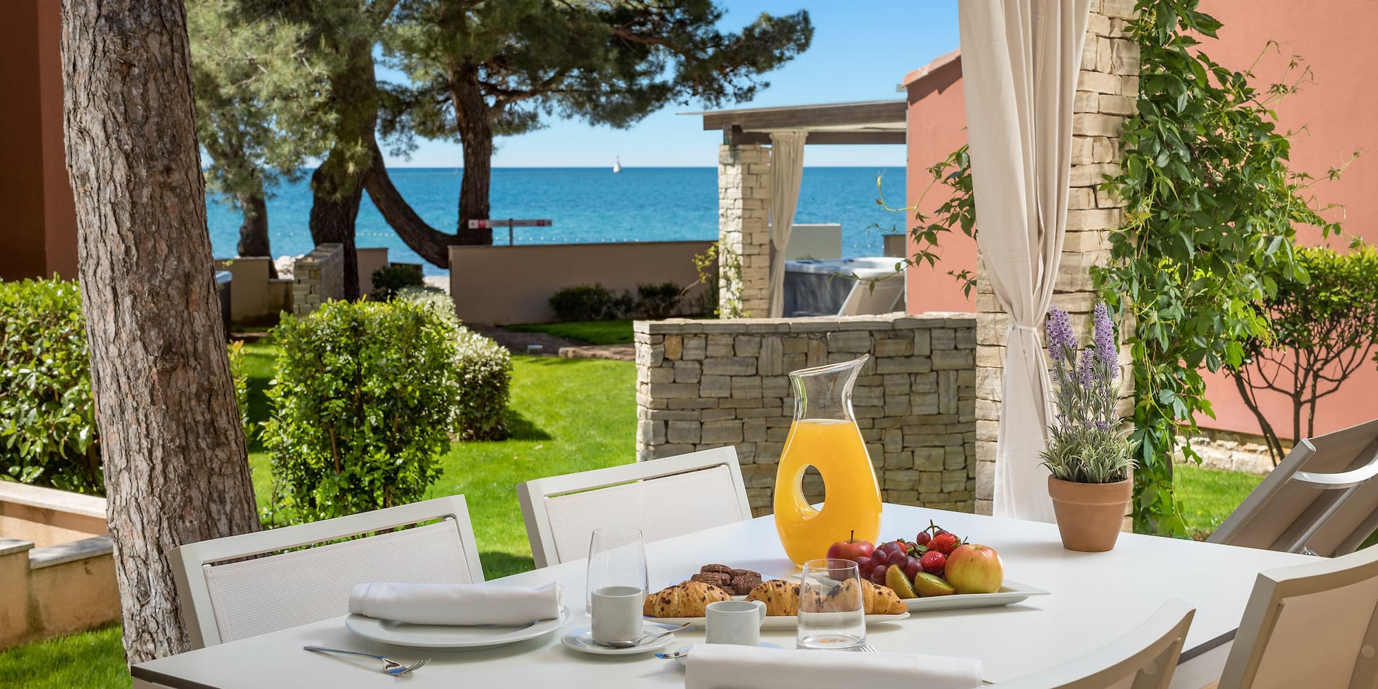 a table with food on it and a glass pitcher on it