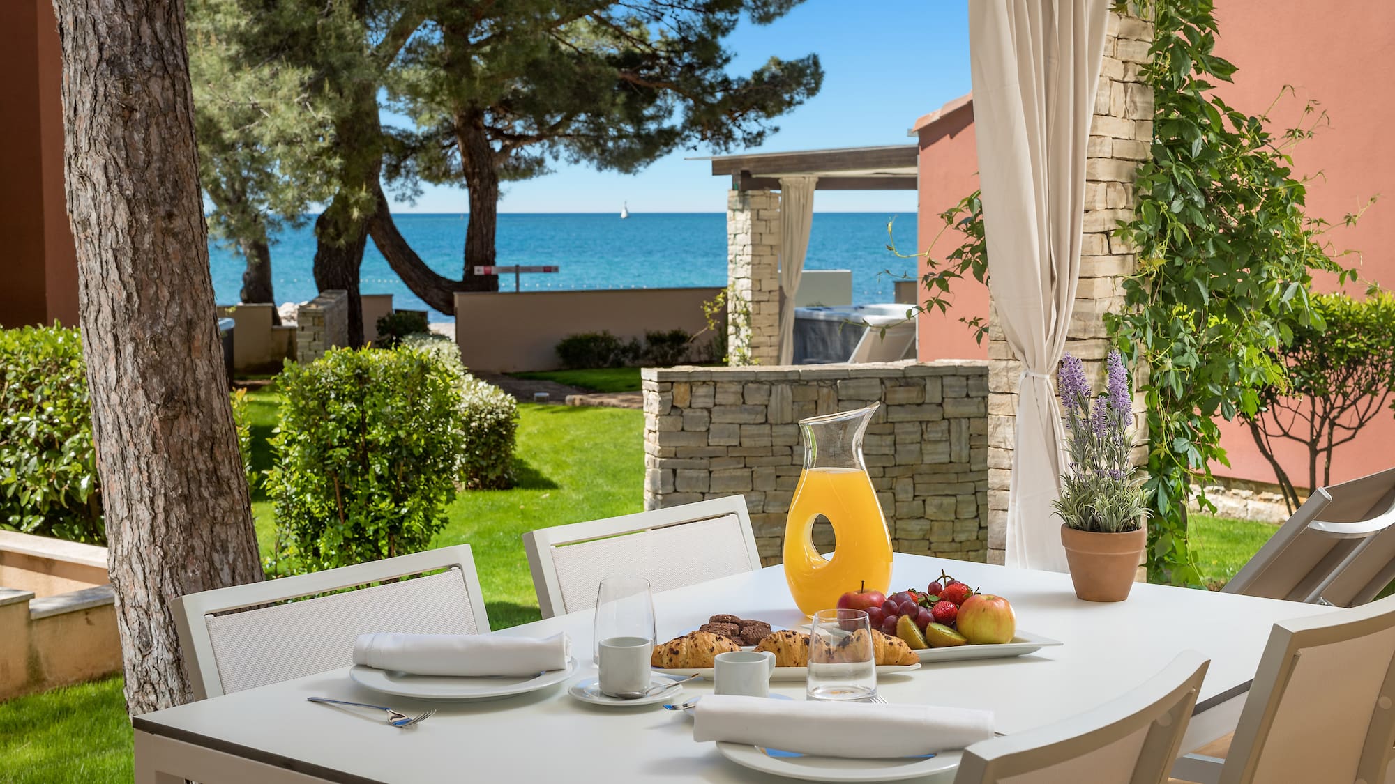 a table with food on it and a glass pitcher on it