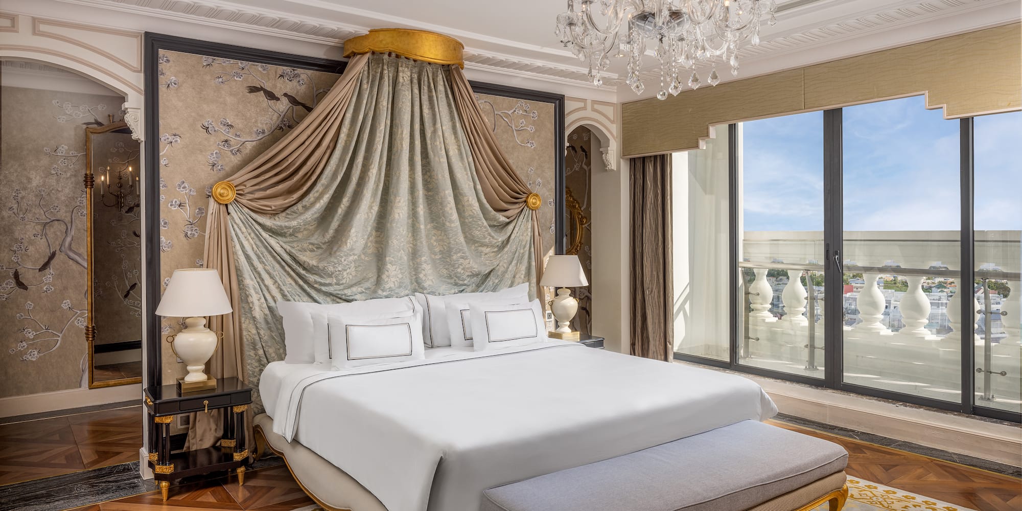 a bedroom with a bed and chandelier