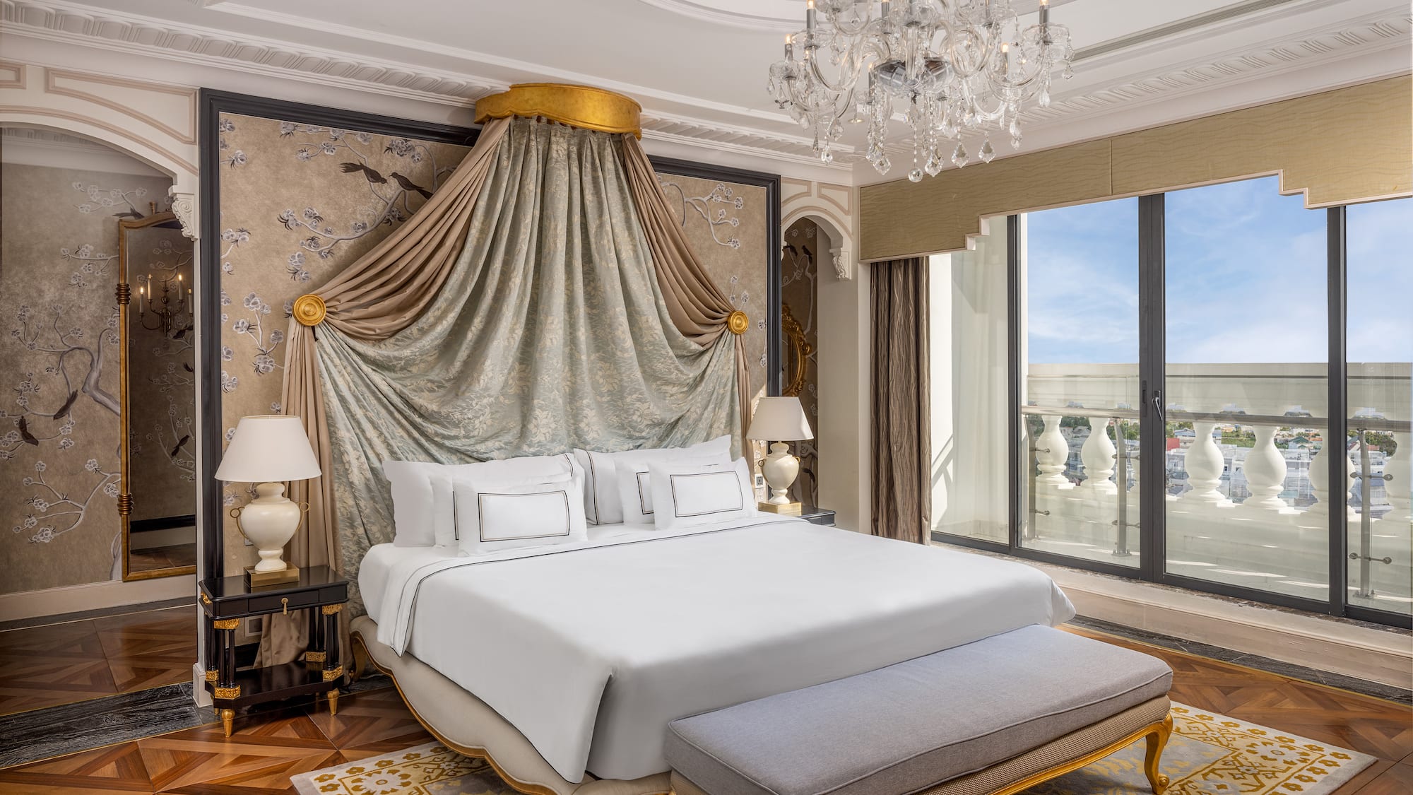 a bedroom with a bed and chandelier