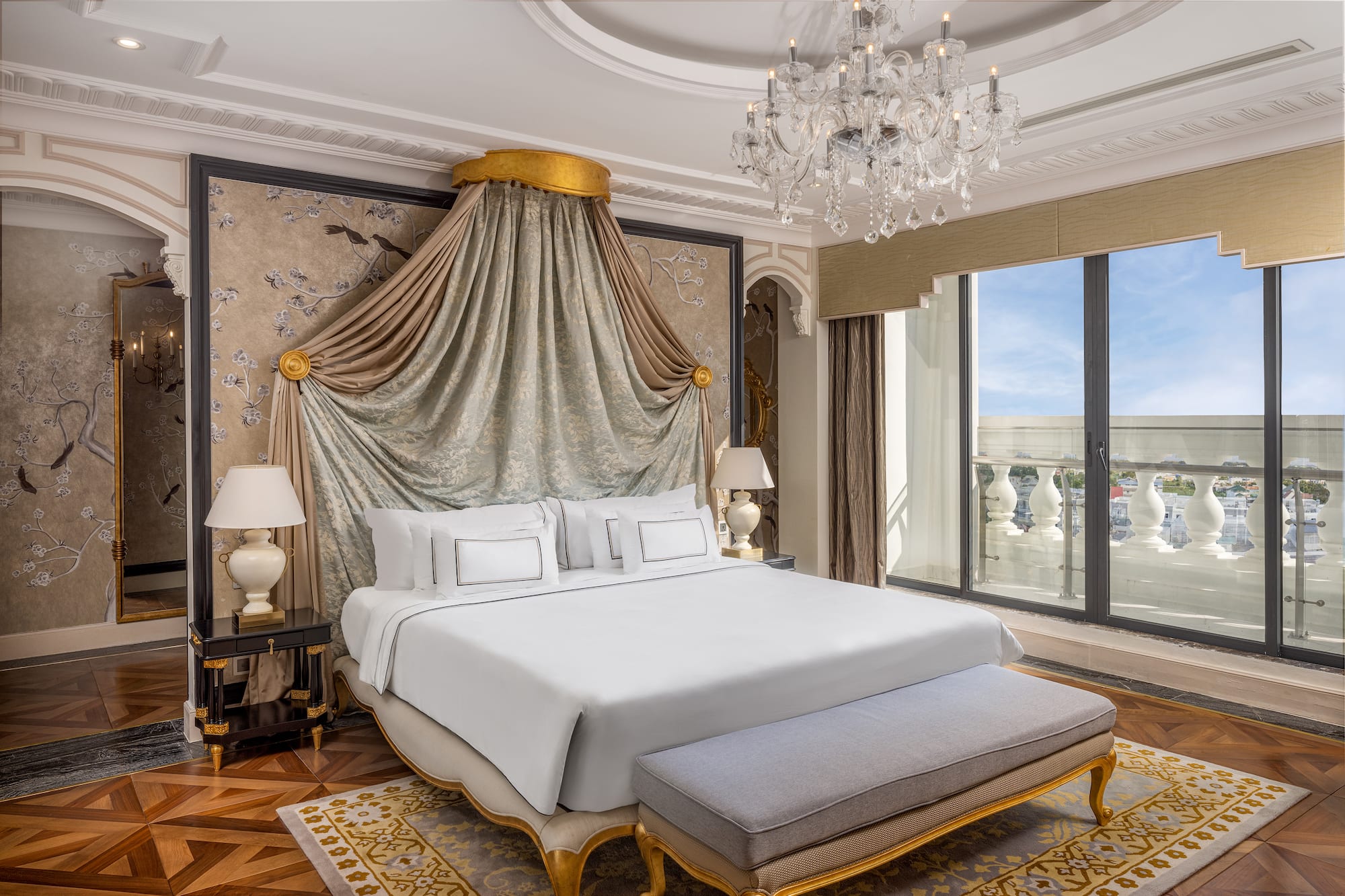 a bedroom with a bed and chandelier