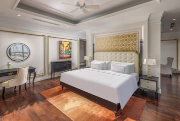 a bedroom with a bed and a table
