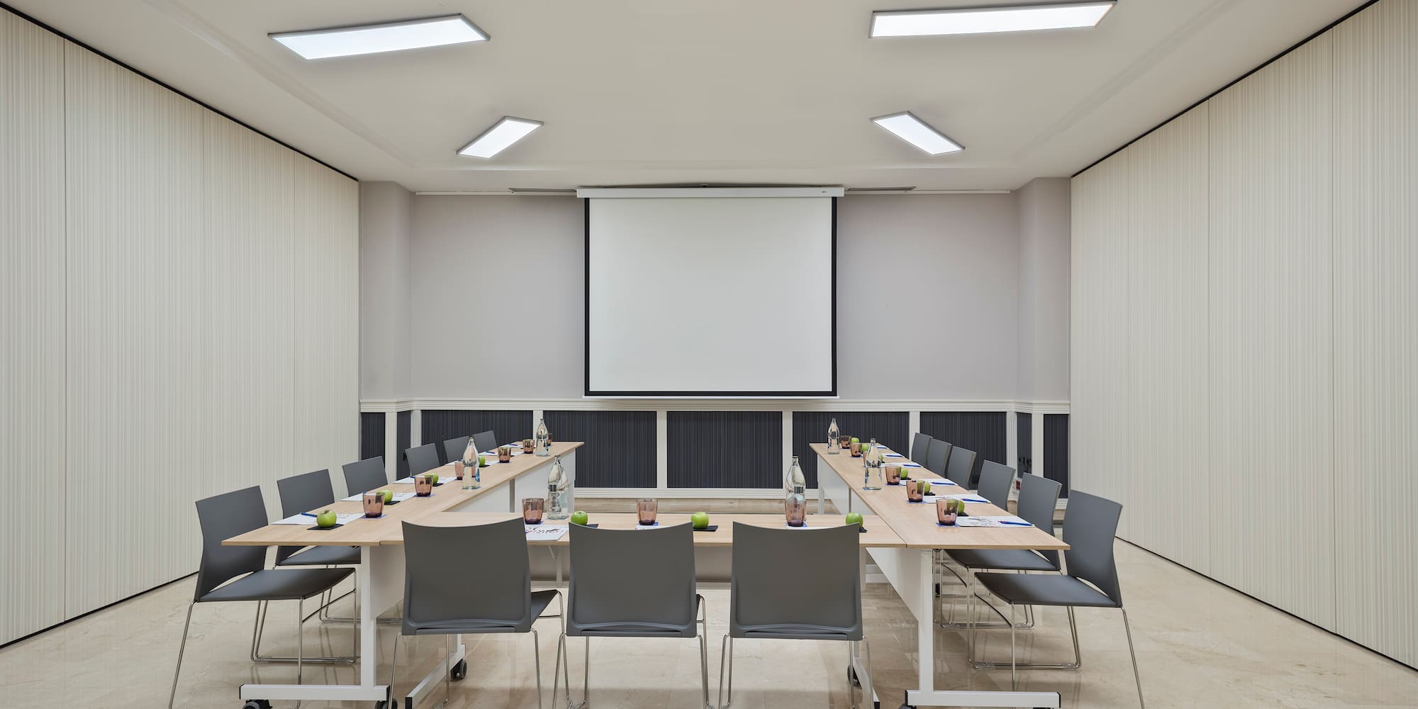 a room with a large table and chairs