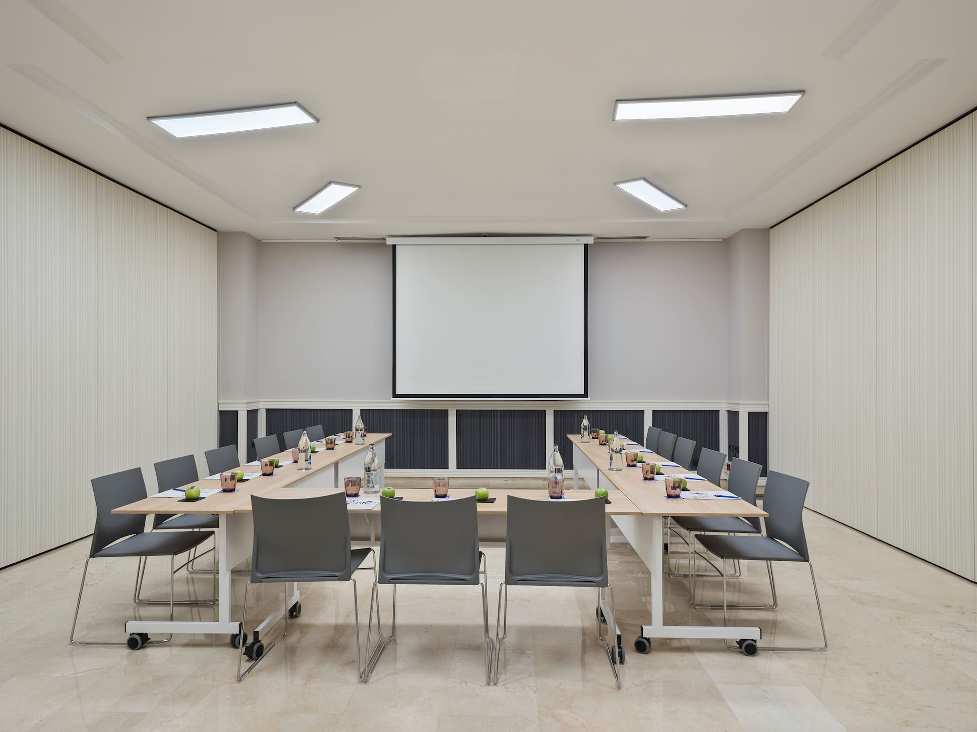 a room with a large table and chairs