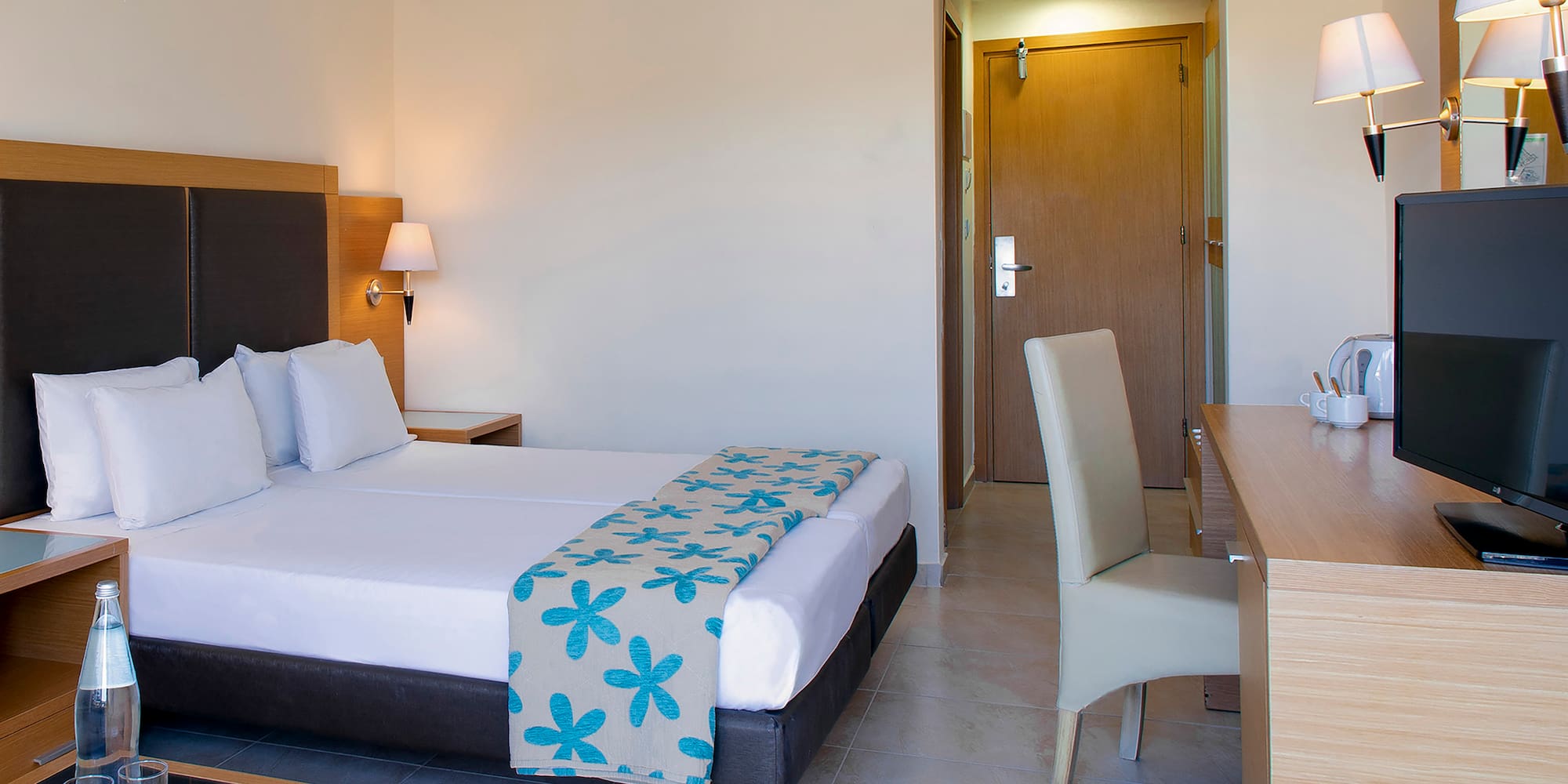 a room with a bed and a desk