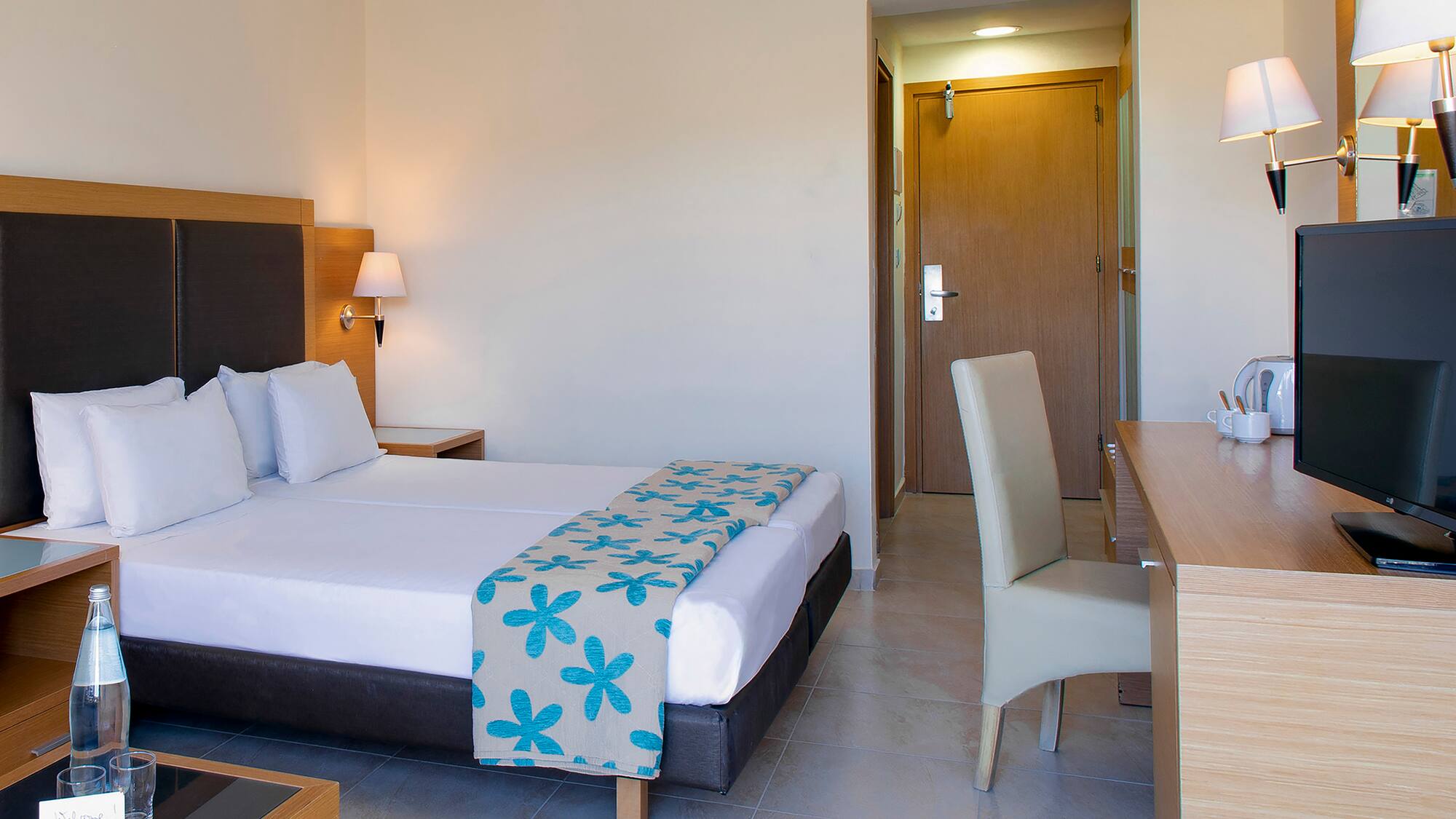 a room with a bed and a desk