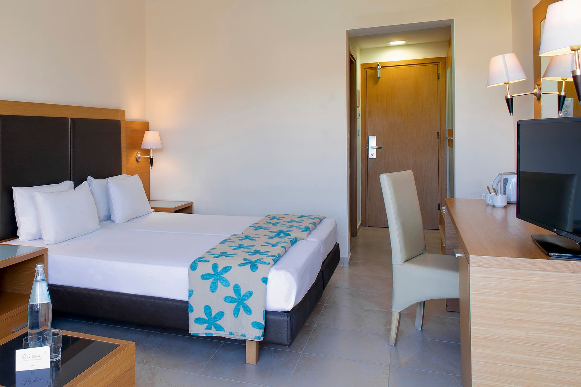 a room with a bed and a desk