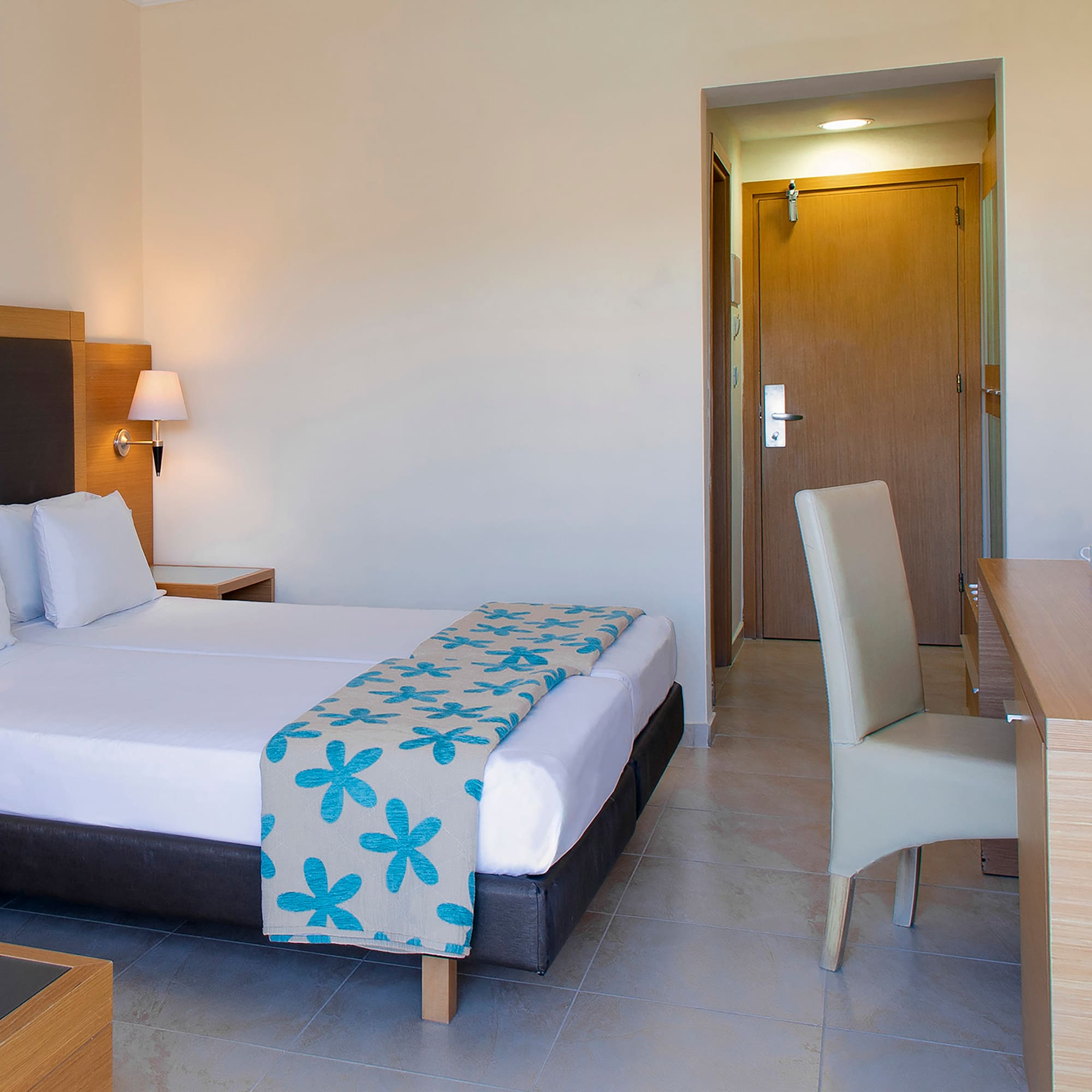 a room with a bed and a desk