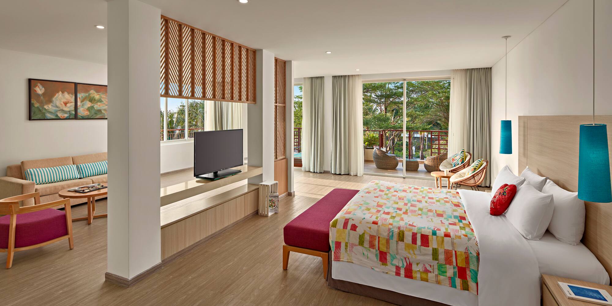 a bedroom with a bed and a television