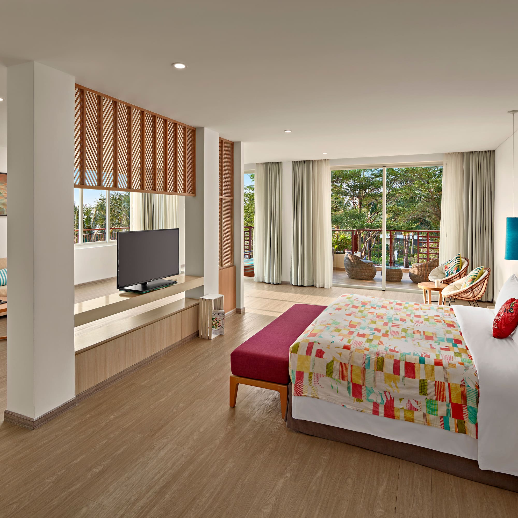 a bedroom with a bed and a television