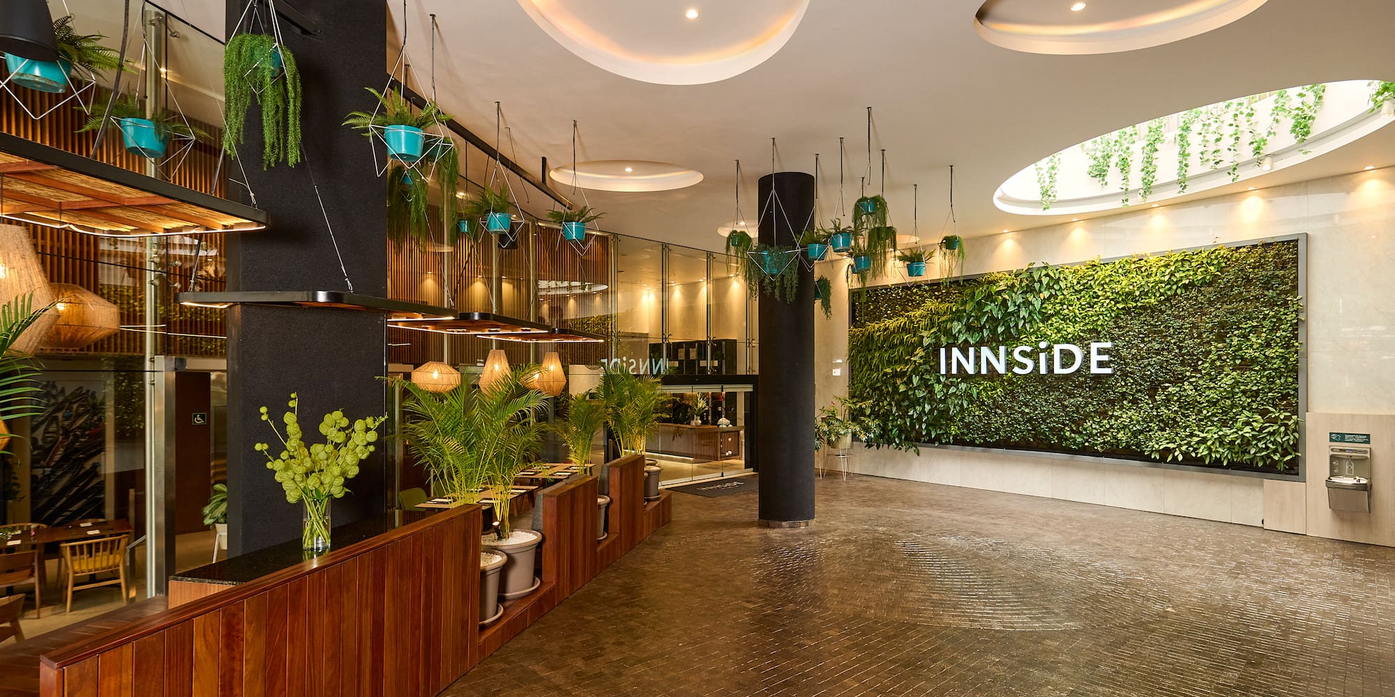 a room with plants and a sign