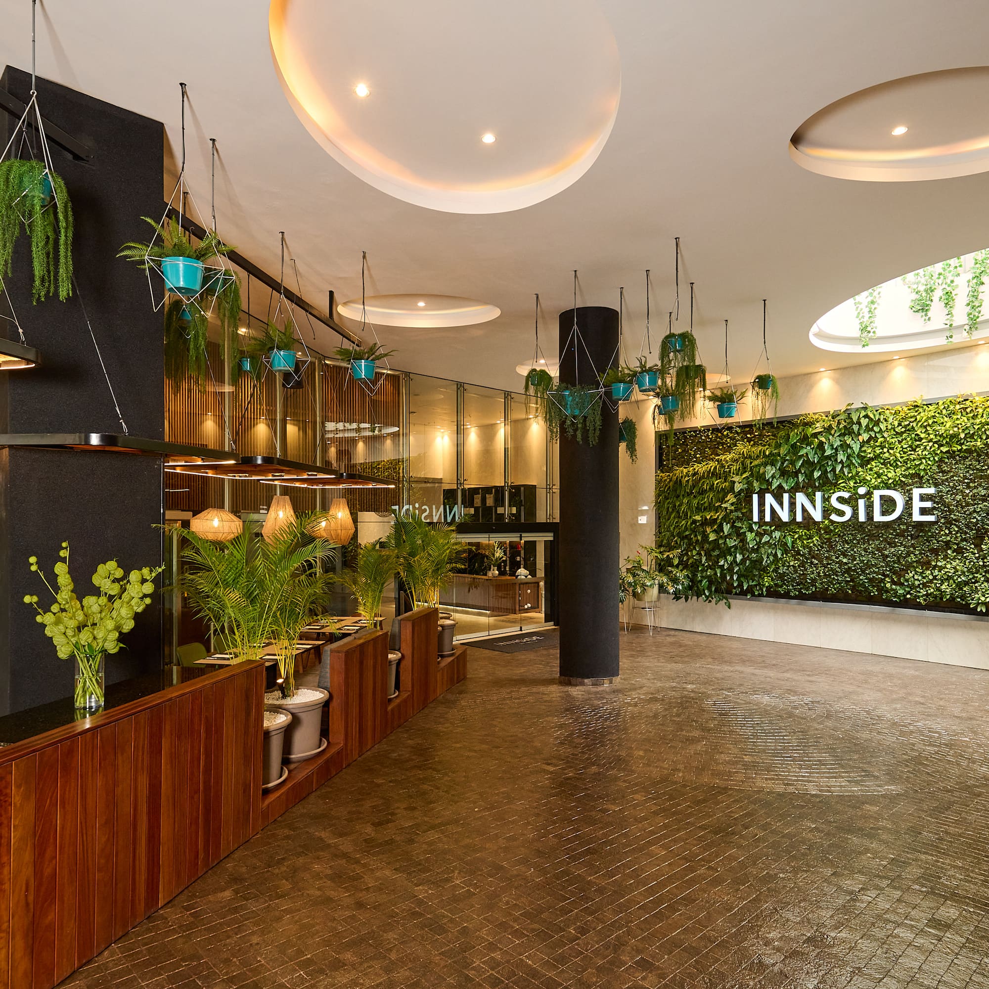 a room with plants and a sign