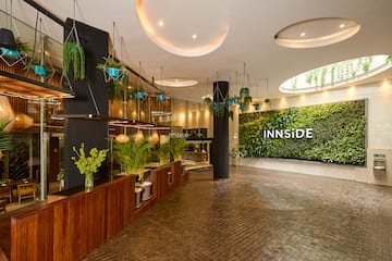 a room with plants and a sign