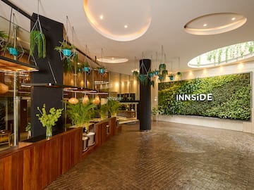 a room with plants and a sign