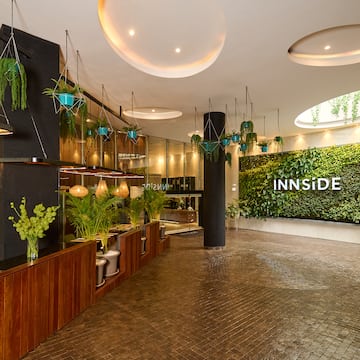 a room with plants and a sign