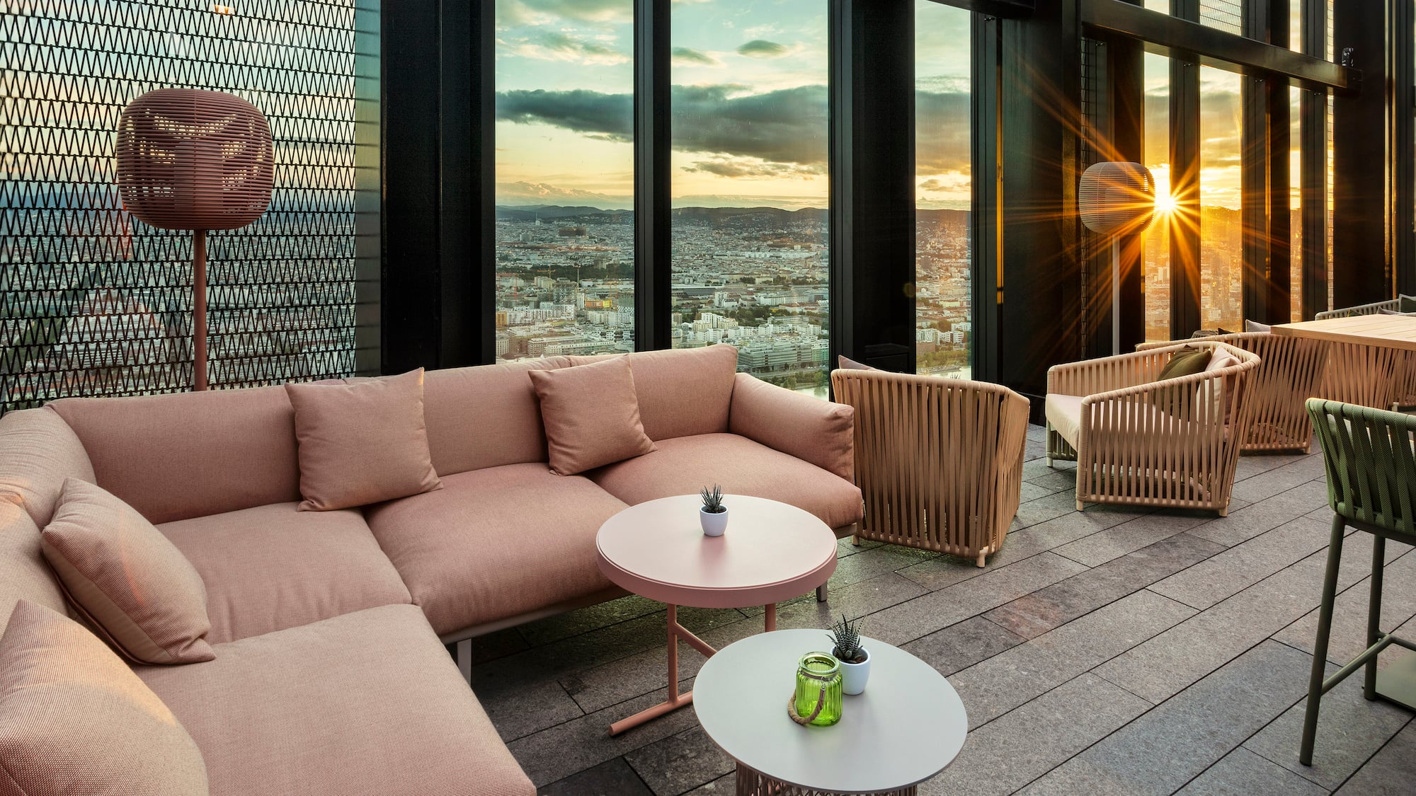 a room with a couch and chairs and a table