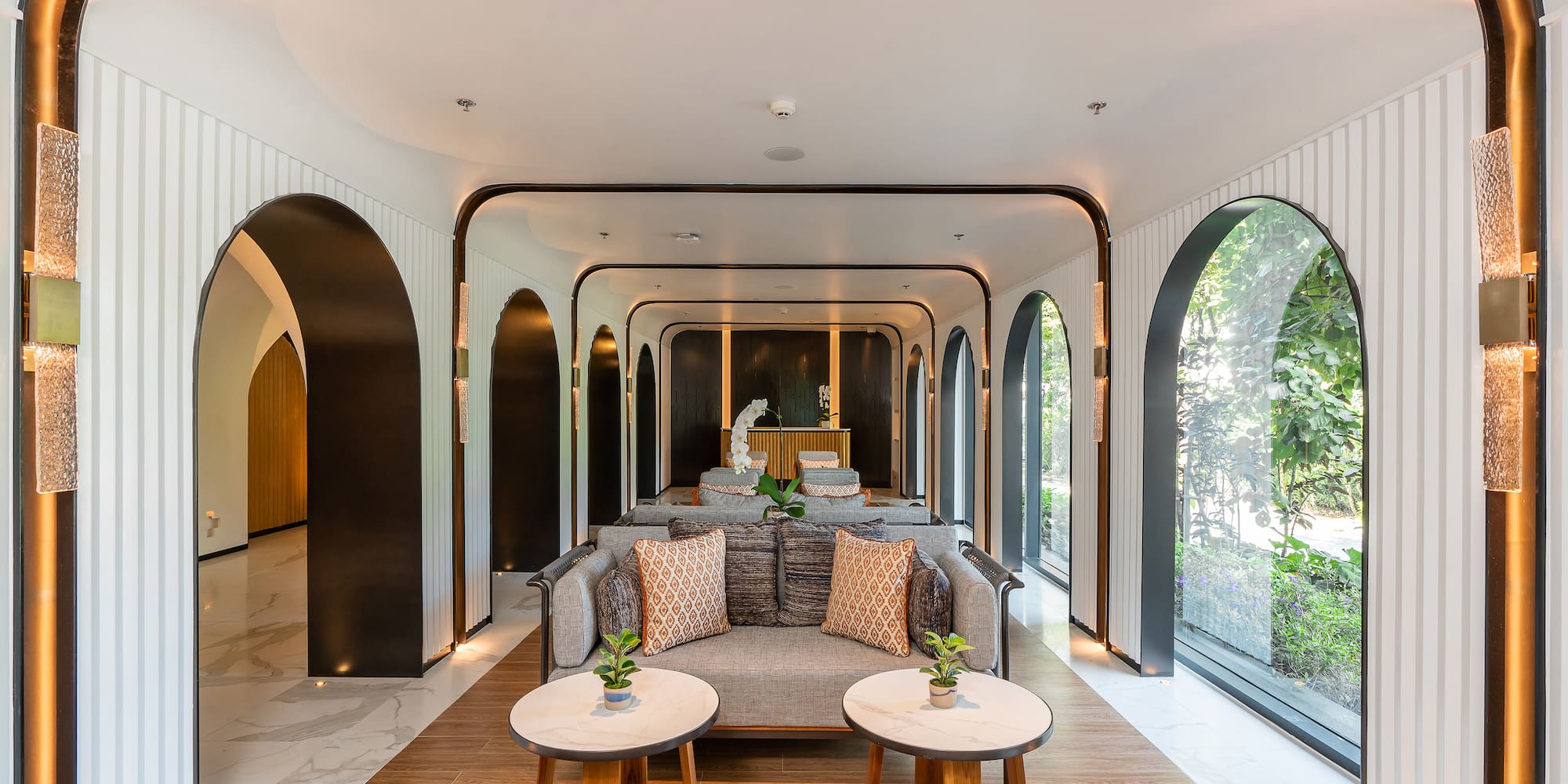 a room with a couch and tables