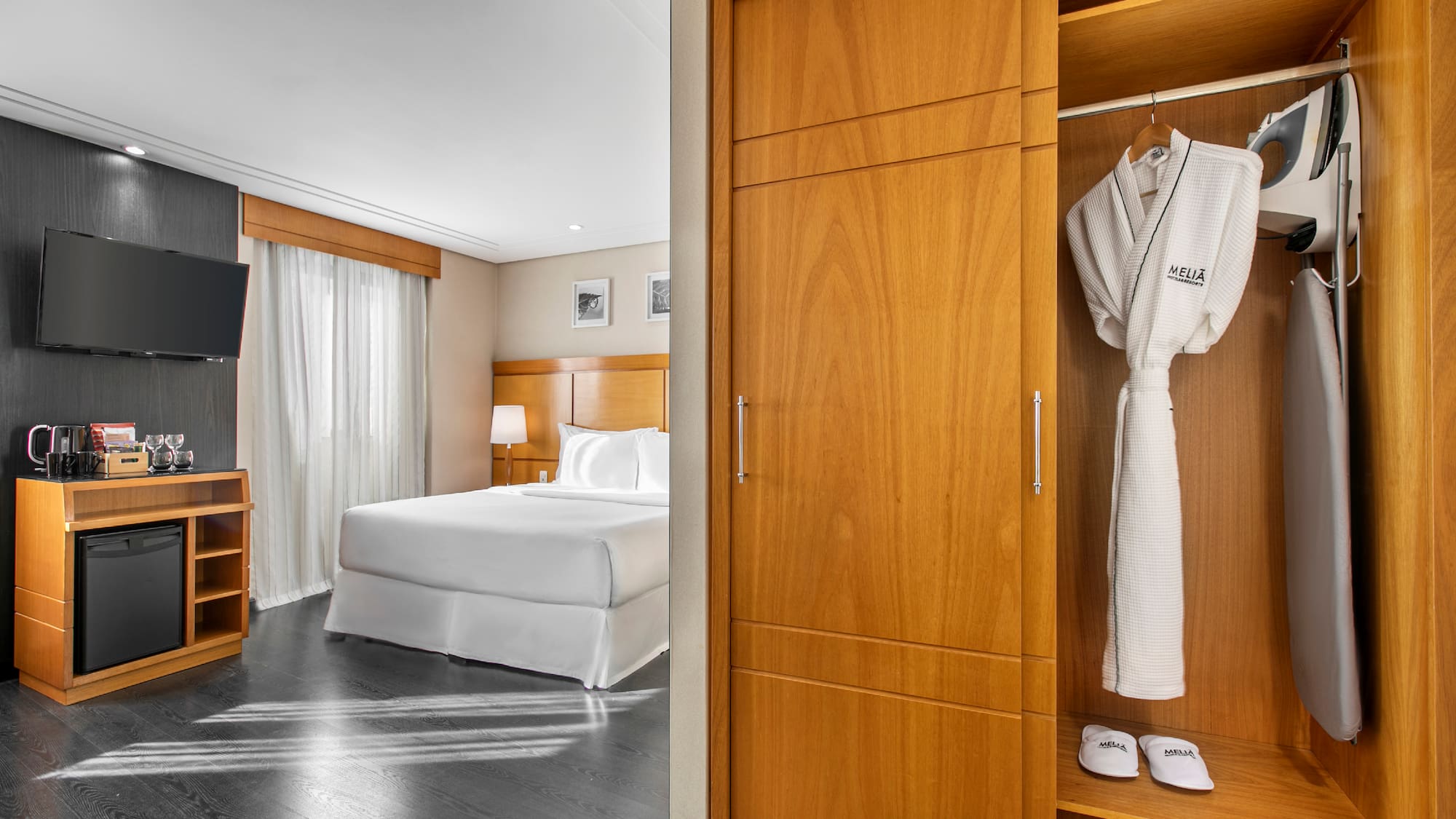 a room with a bed and a white robe