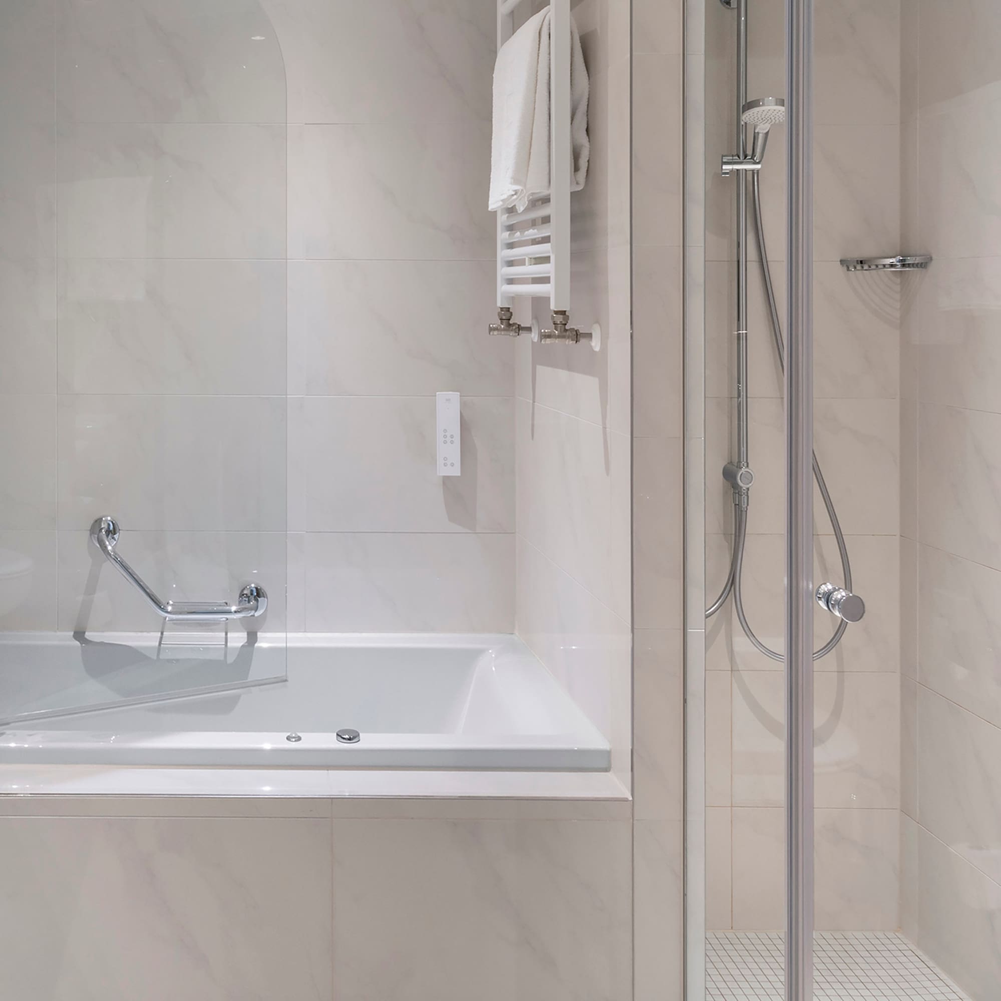 a bathroom with a bathtub and shower