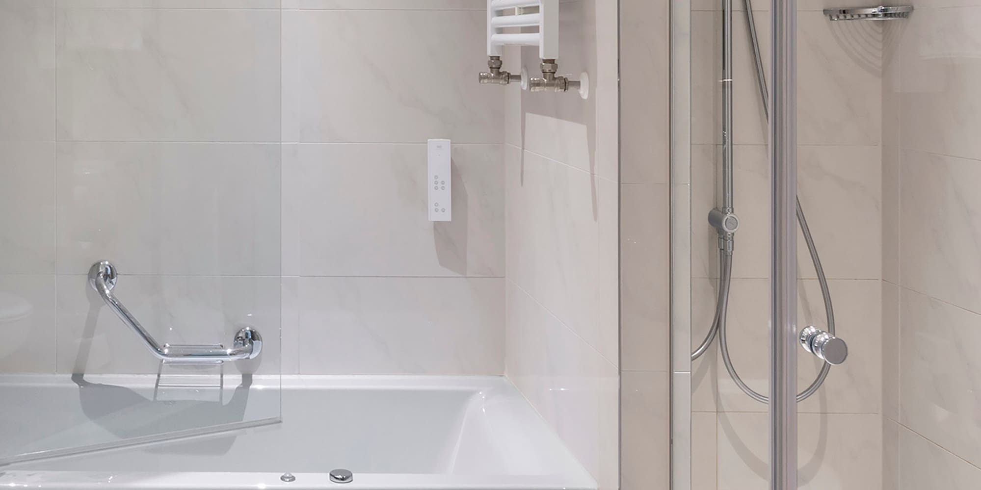 a bathroom with a bathtub and shower