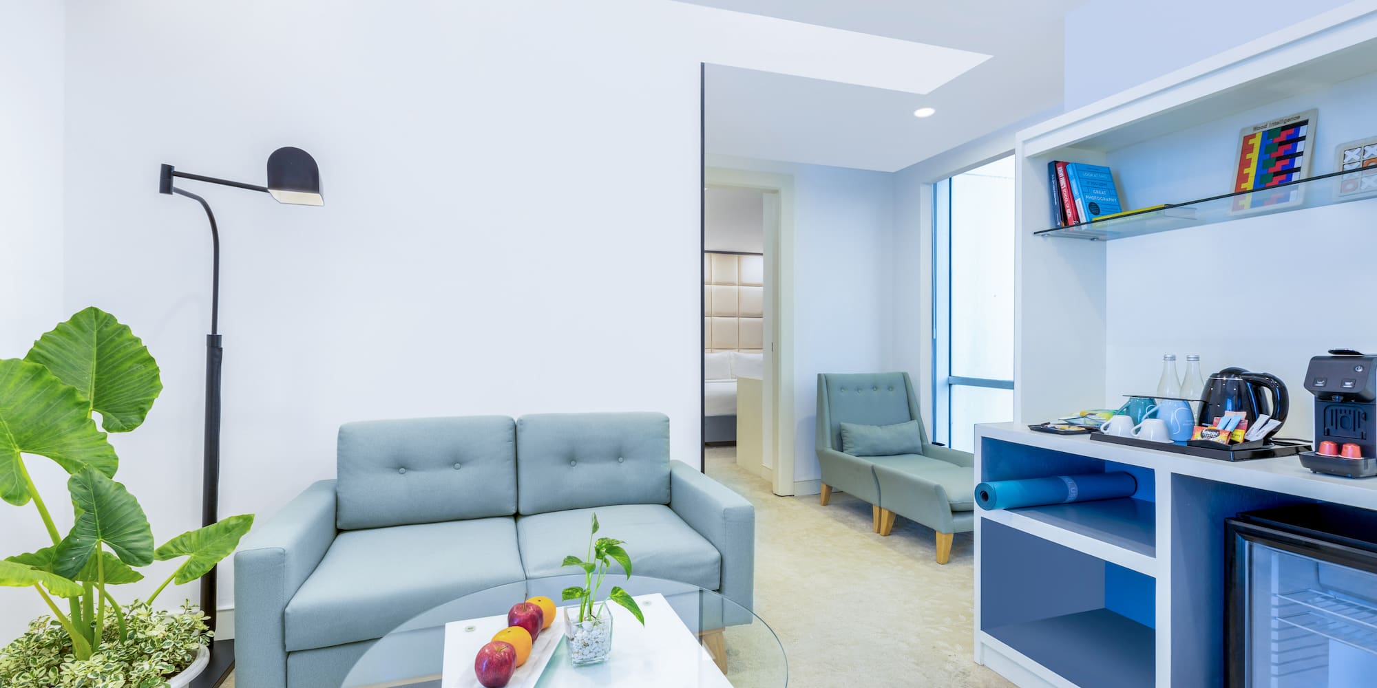 a room with a couch and a glass table