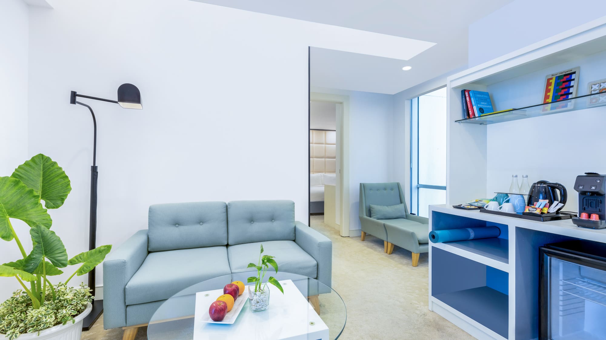 a room with a couch and a glass table