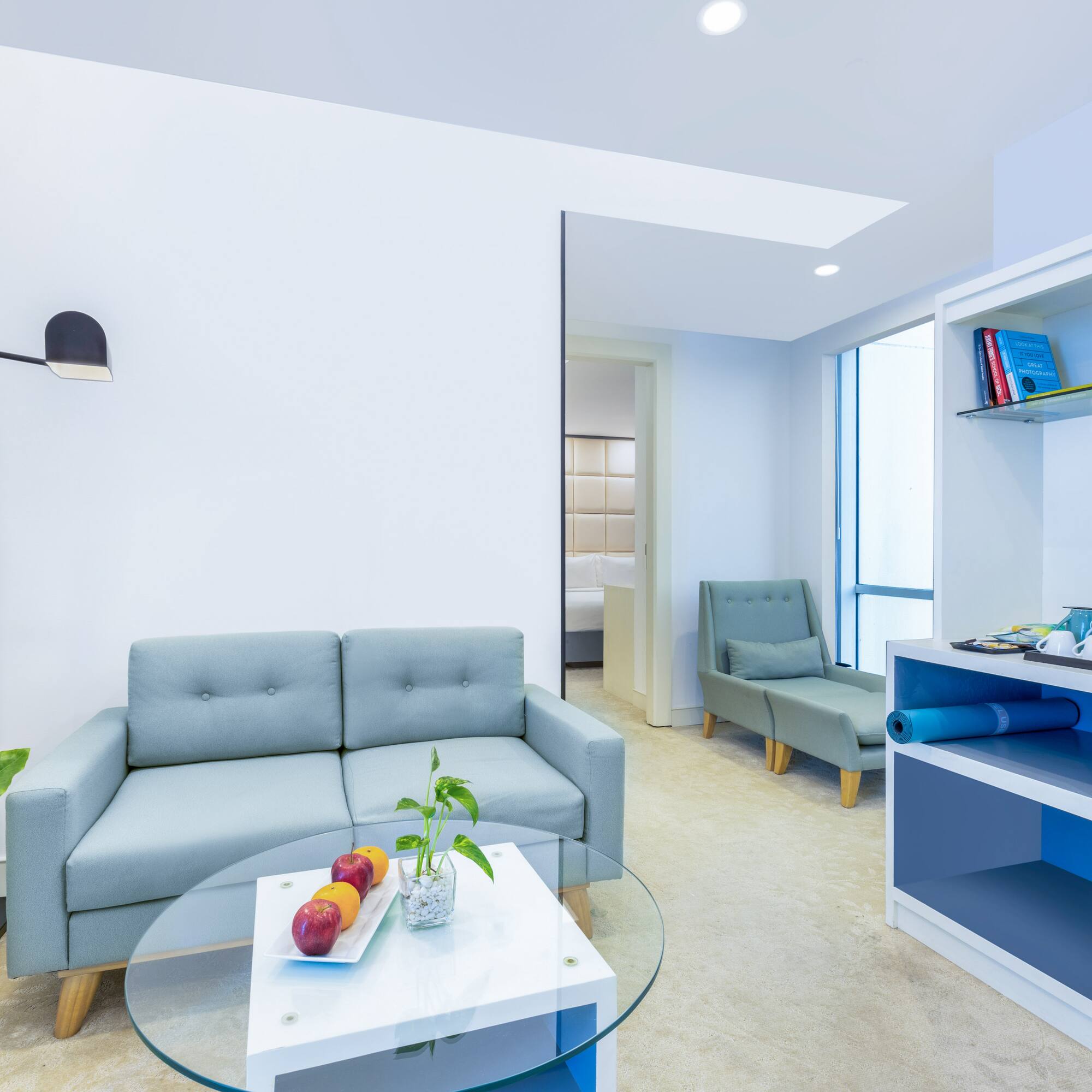 a room with a couch and a glass table