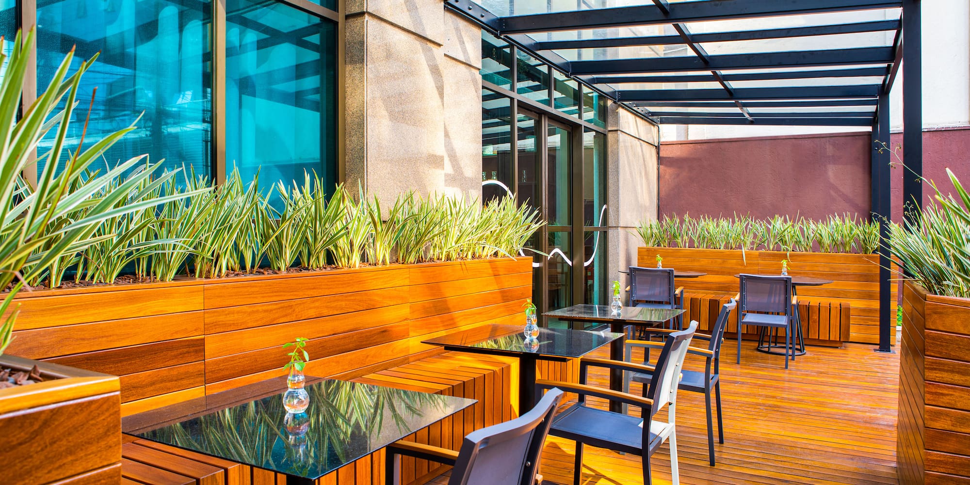 a patio with tables and chairs