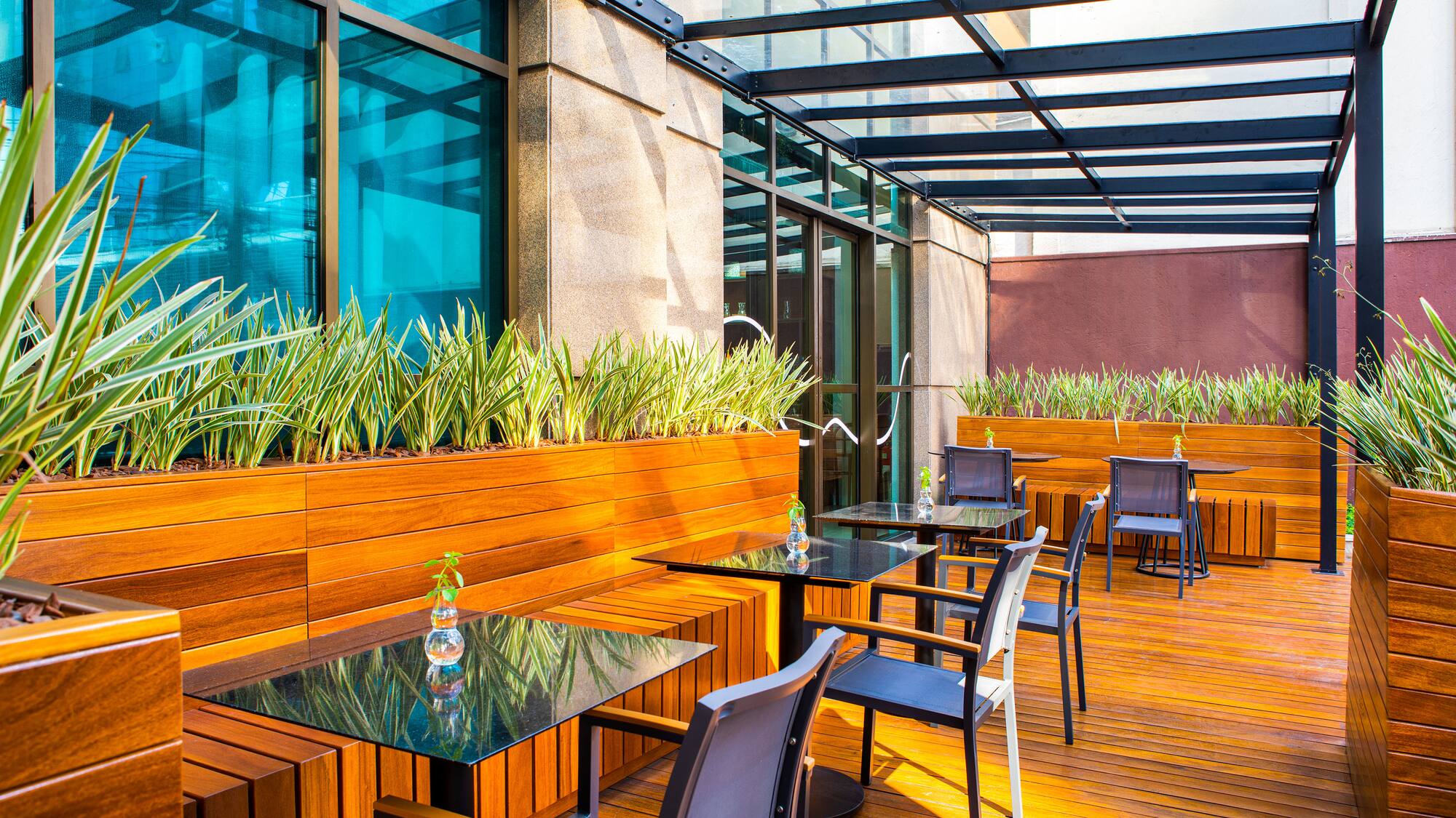 a patio with tables and chairs